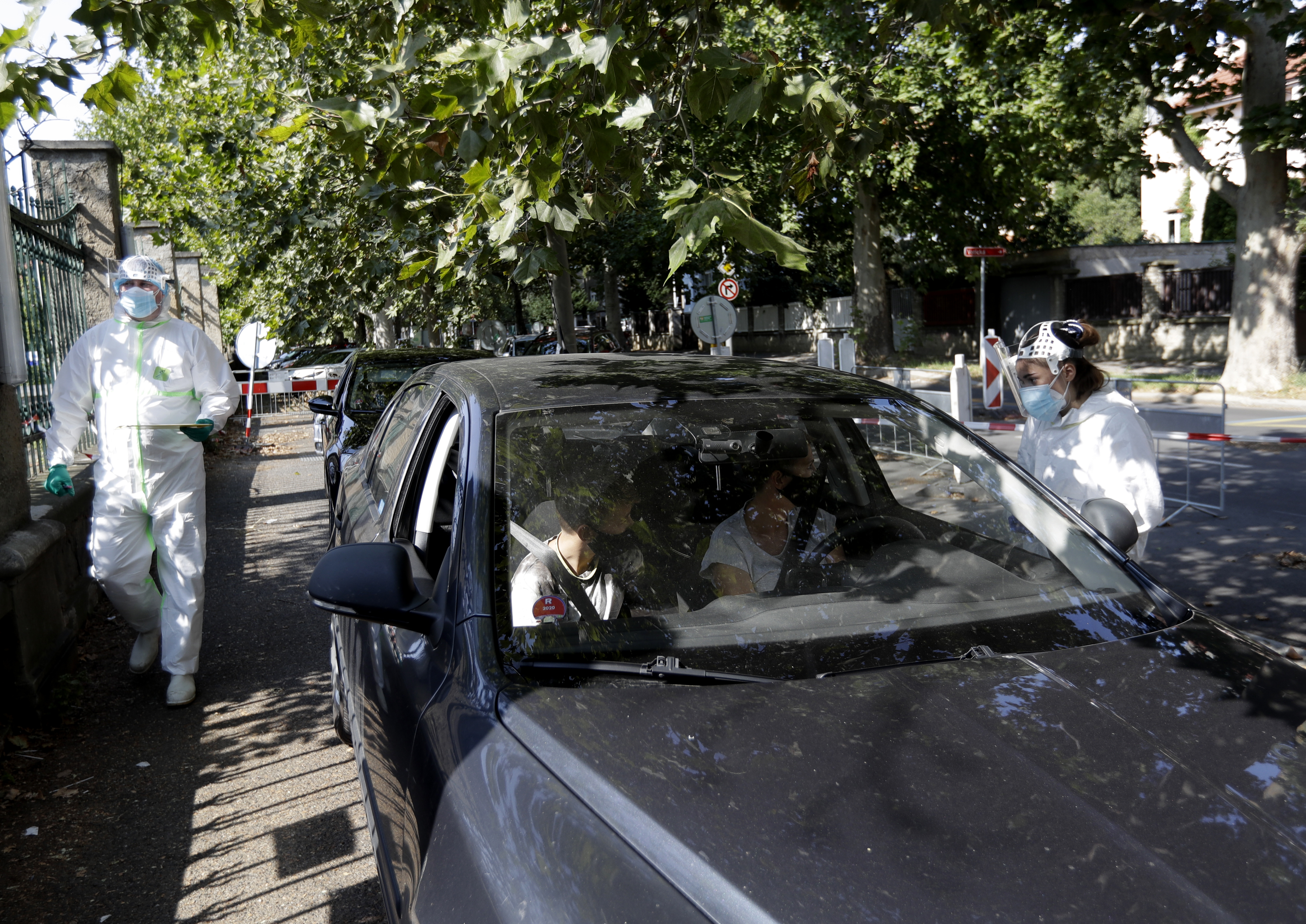 People wait to get tested for COVID-19 at a drive-in sampling station in Prague, Czech Republic, Saturday, Sept. 12, 2020. (Petr David Josek—AP Photo/Getty Images)