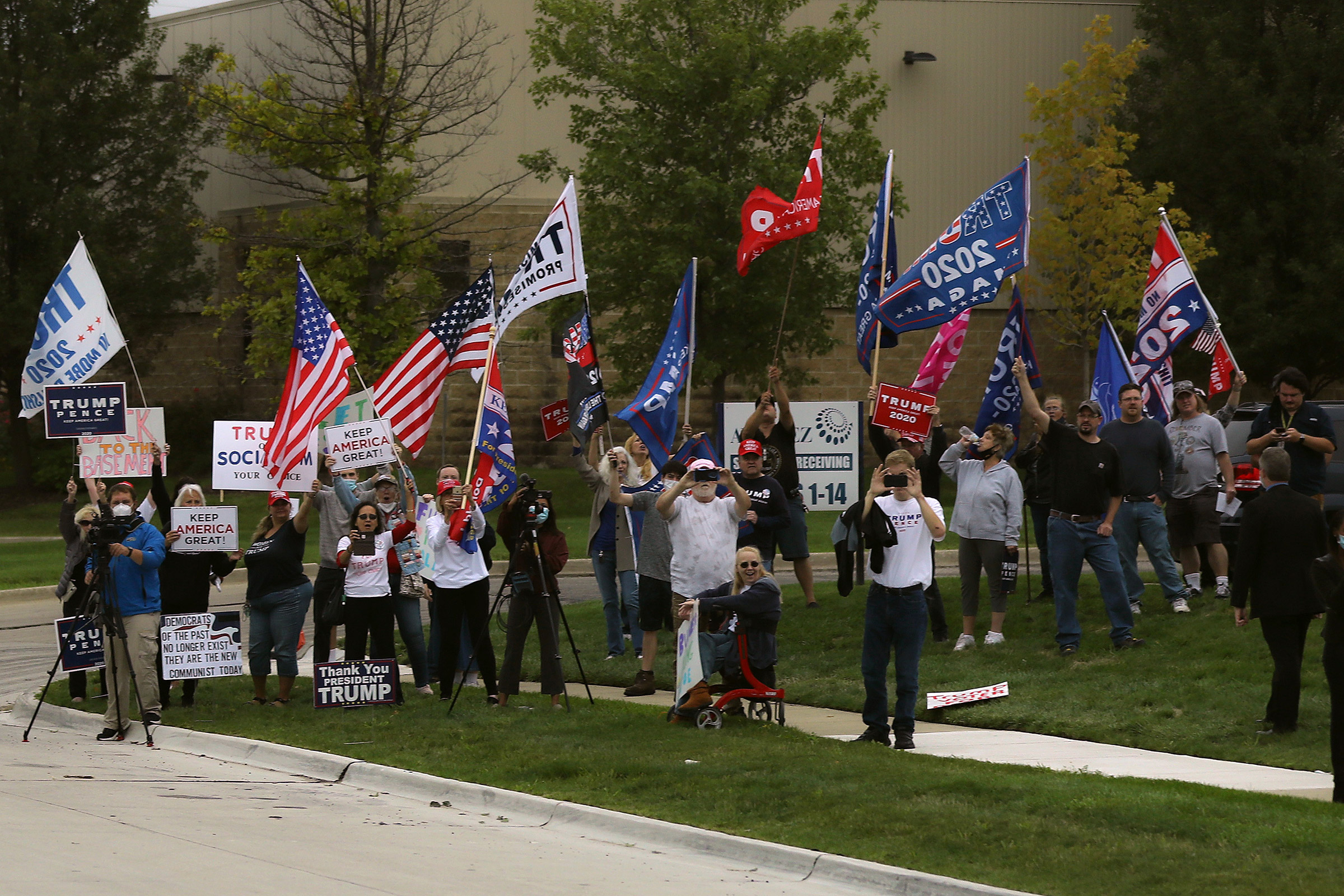Supporters of President Donald Trump gather across the street from the United Auto Workers Region 1 offices where Democratic presidential nominee and former Vice President Joe Biden is scheduled to speak in Warren, Mich., on Sept. 09, 2020. (Chip Somodevilla—Getty Images)