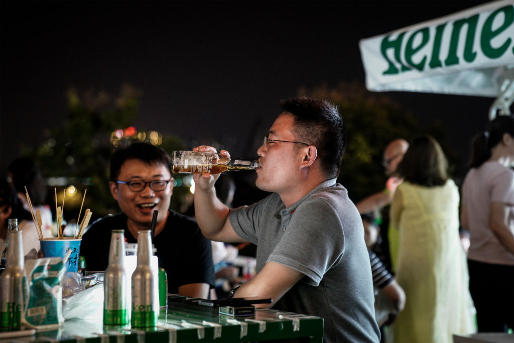 Residents drink during the Wuhan Beer Festival on August 21, 2020 in Wuhan, Hubei, China. (Getty Images)