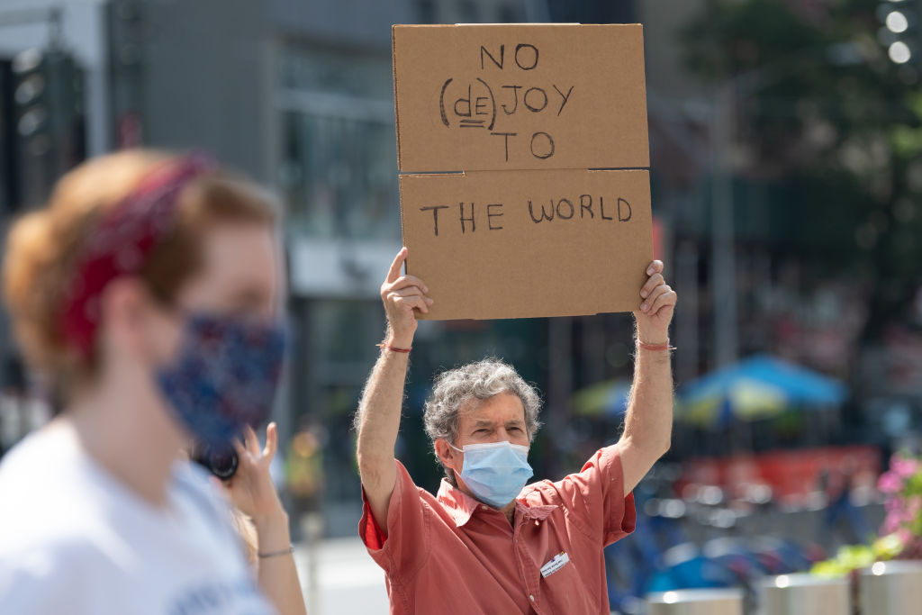 A man at the "Save The Post Office" rally outside a post office building on August 25, 2020 in New York City. (Alexi Rosenfeld—Getty Images)