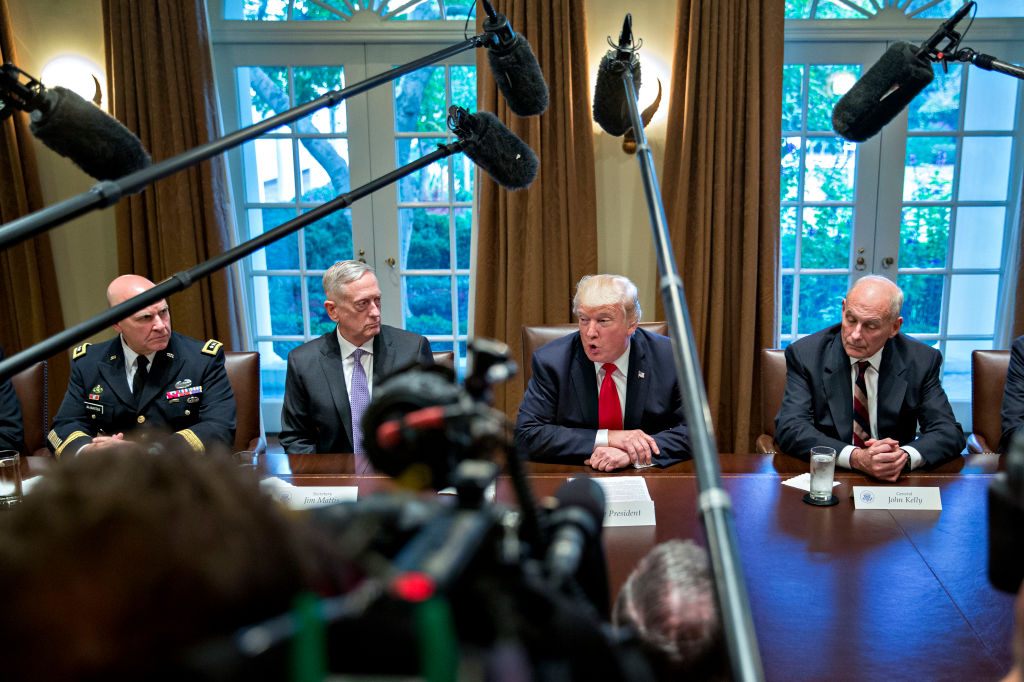 U.S. President Donald Trump (C), then national security advisor H.R. McMaster (L), Defense Secretary Jim Mattis  (2nd L) and then White House chief of staff John Kelly (R) attend a briefing with senior military leaders in the Cabinet Room of the White House in Washington, D.C., on October 5, 2017. (Andrew Harrer—Pool/Getty Images)