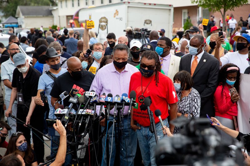 The Rev. Jesse Jackson speaks as he and Justin Blake, uncle of Jacob Blake, meet with reporters near the site where Jacob Blake was shot by police in Kenosha, Wis., on Tuesday Sept. 1, 2020.