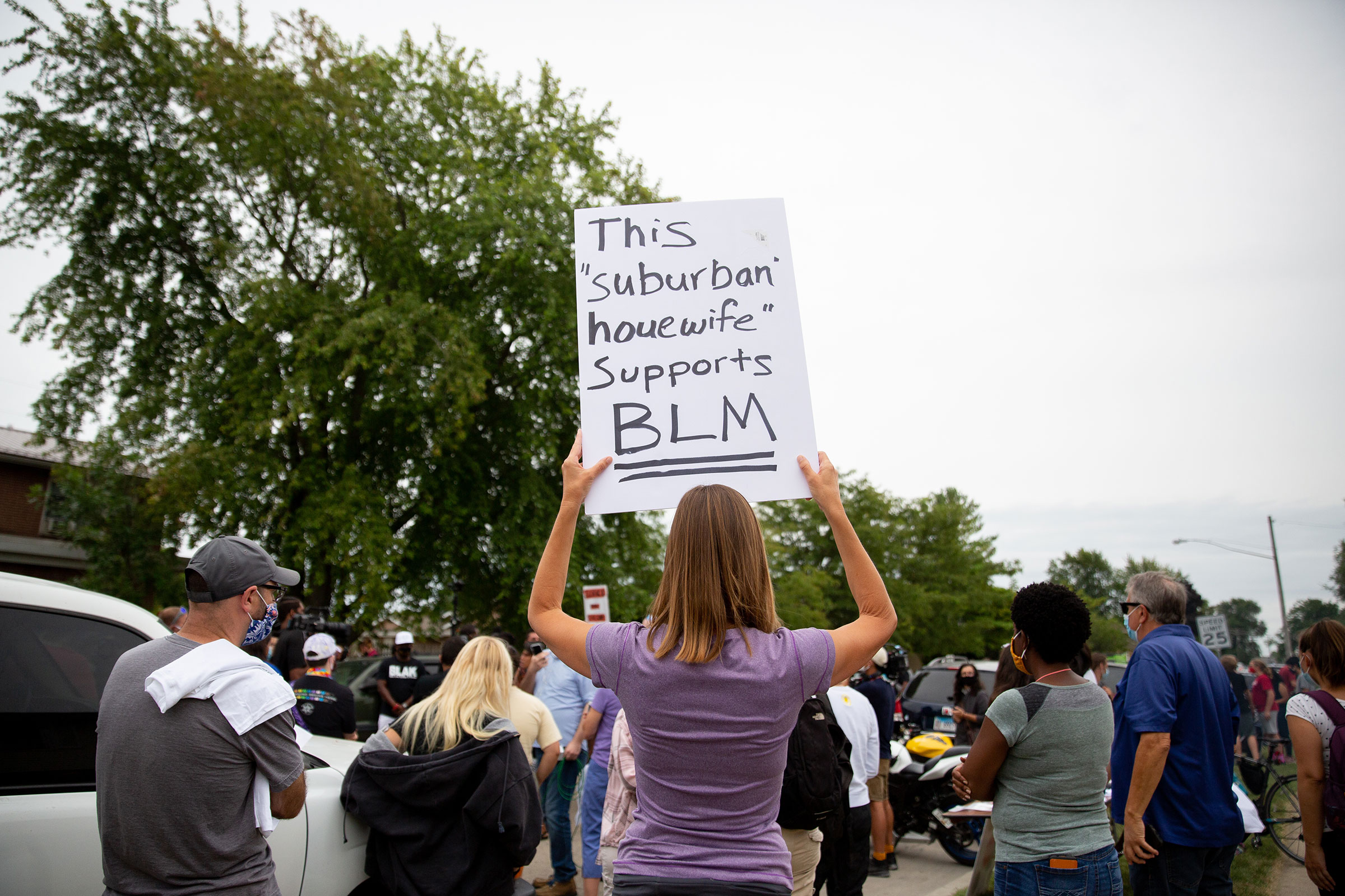 A supporter of Jacob Blake’s family holds a sign up at a peaceful gathering near the site where Blake was shot by police in Kenosha, Wis., on Tuesday Sept. 1, 2020.