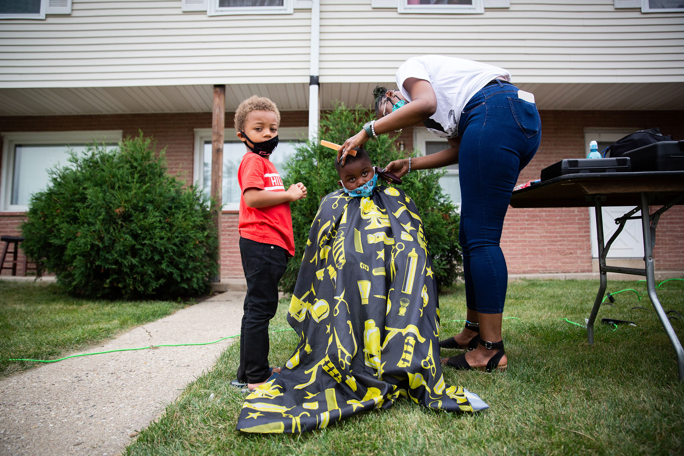 A young boy gets his haircut at the community gathering hosted by Jacob Blake’s family in Kenosha, Wis., on Sept. 1, 2020. (Patience Zalanga for TIME)