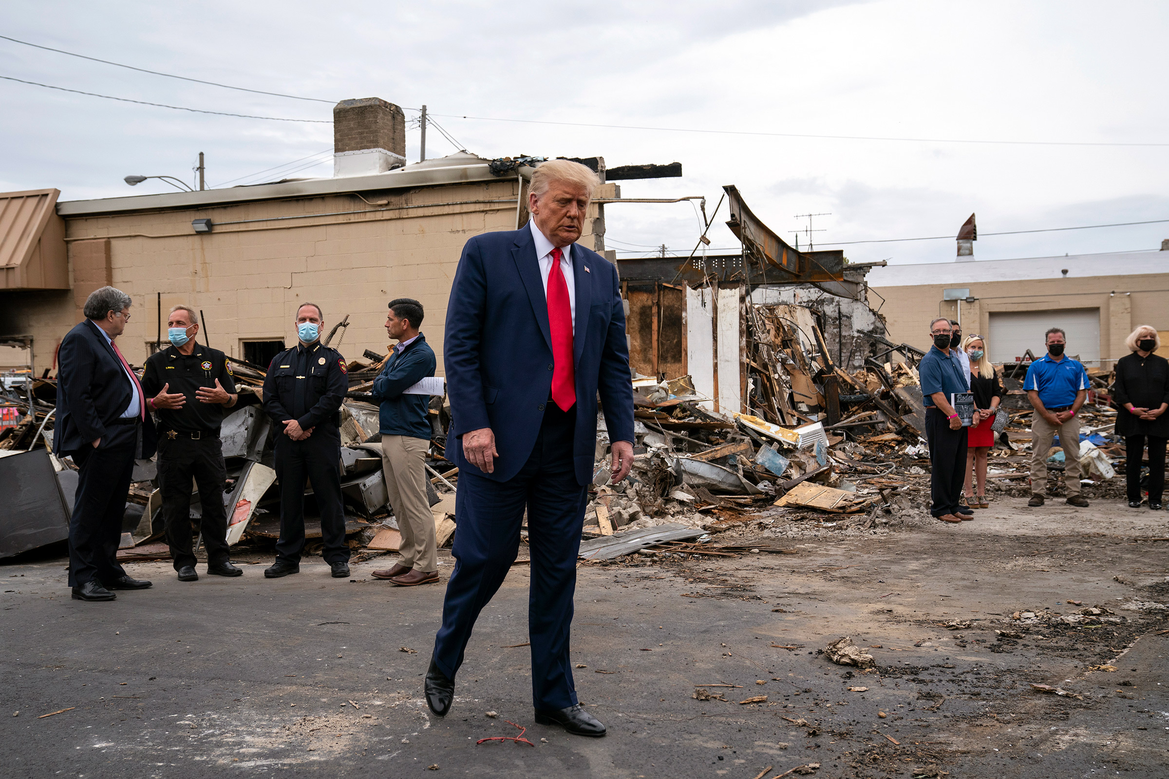 President Donald Trump tours an area Tuesday that was damaged during demonstrations after a police officer shot Jacob Blake in Kenosha, Wis., on Sept. 1, 2020. (Evan Vucci—AP)