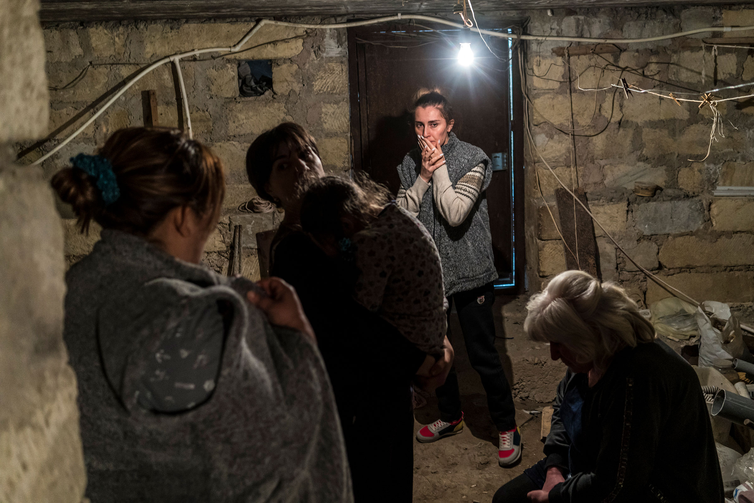 Residents shelter in a basement as air raid sirens sound on Sept. 29, 2020 in Stepanakert, Nagorno-Karabakh