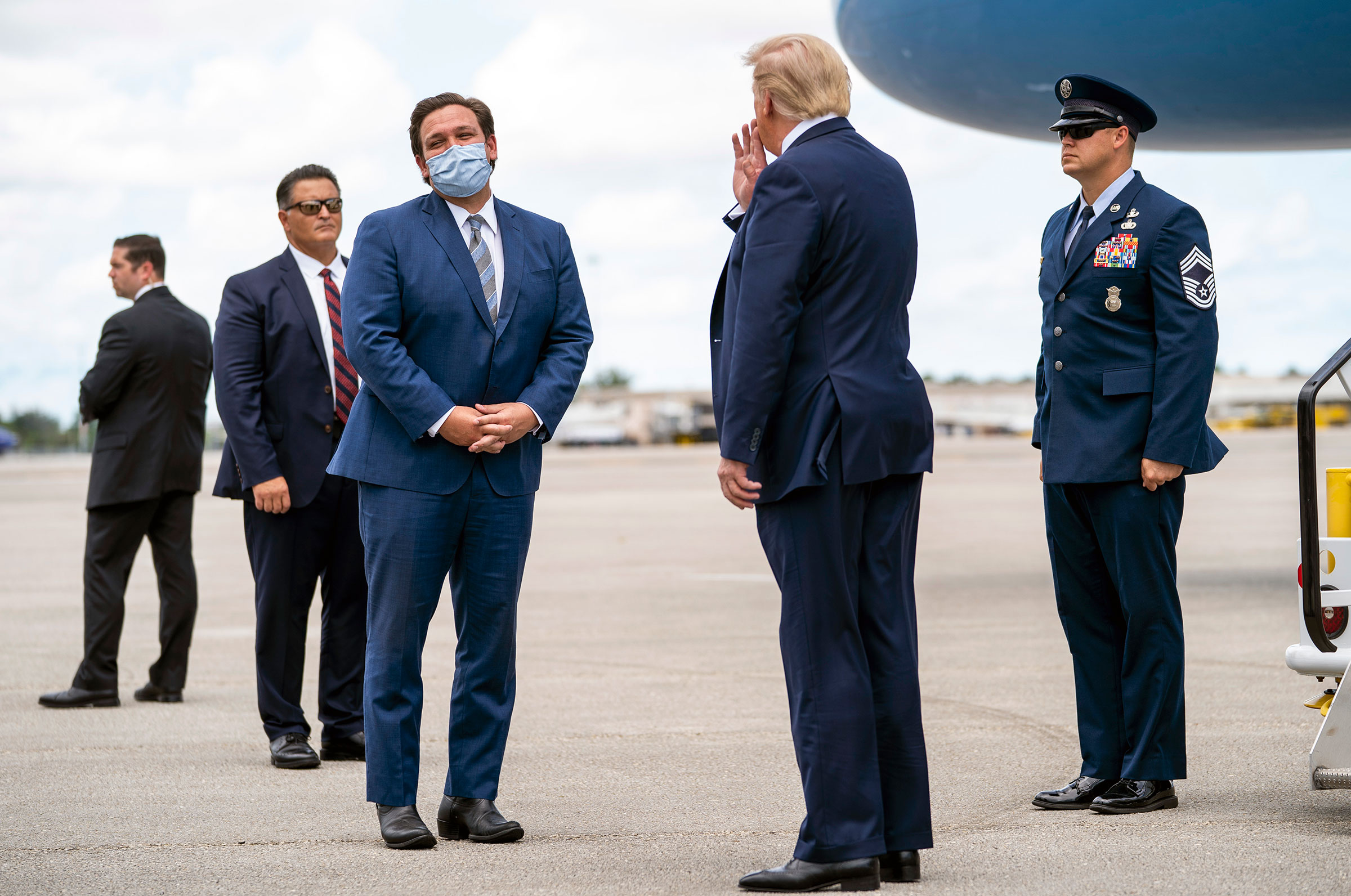 President Donald Trump is greeted by Gov. Ron DeSantis of Florida upon his arrival at Palm Beach International Airport on Sept. 8, 2020. (Doug Mills—The New York Times/Redux)