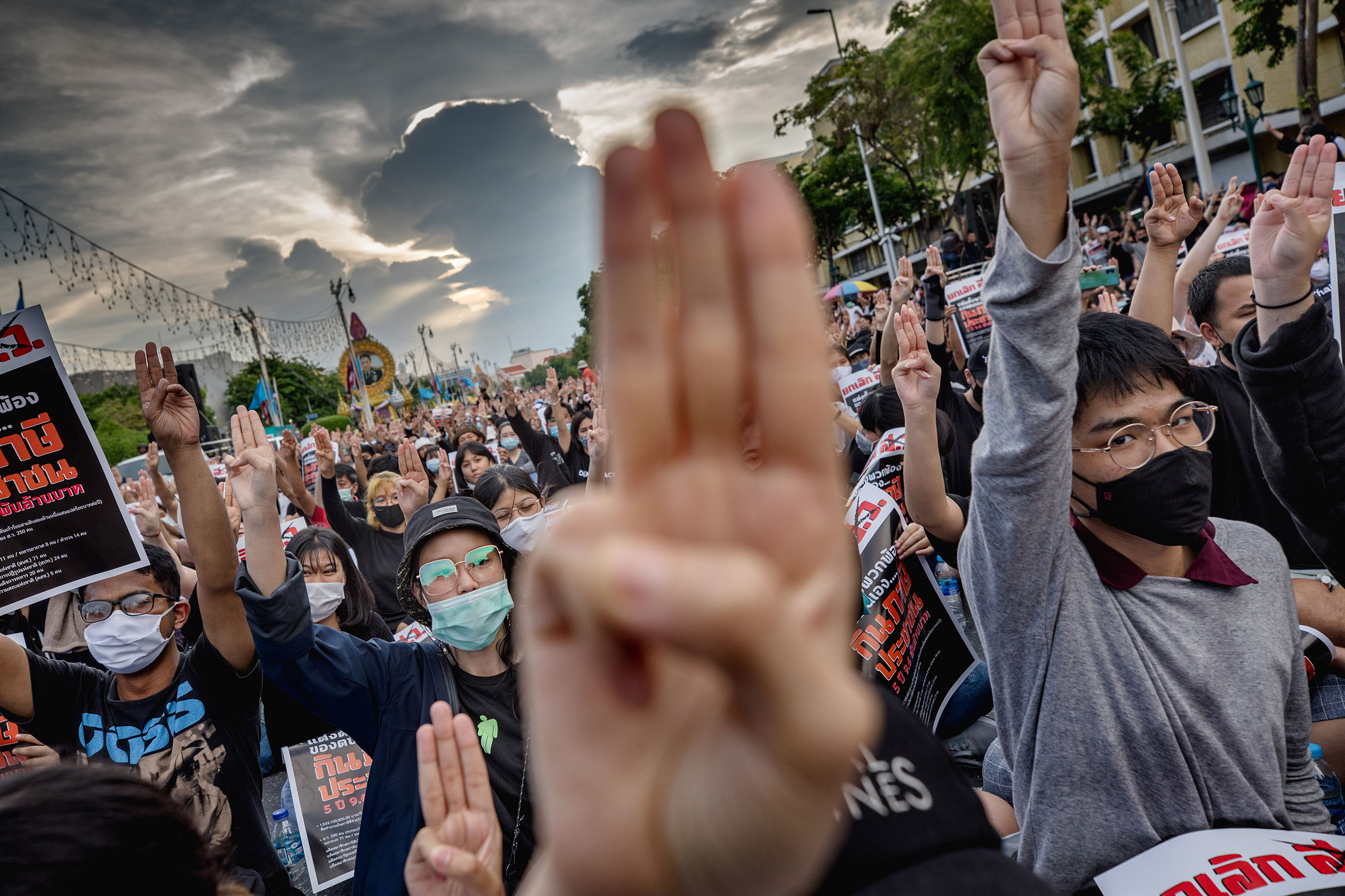 Protesters perform a 'Hunger Games' three finger salute during anti-government demonstration in Bangkok