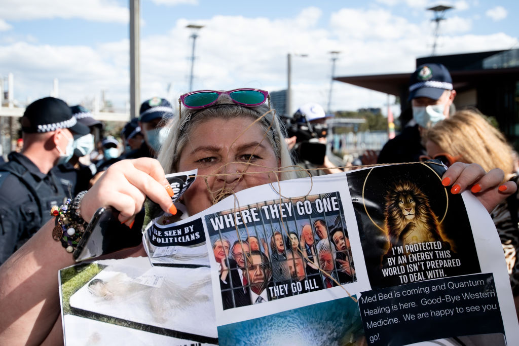 A protester holds a sign up during the Freedom Day Rally in Sydney on Sept. 5, 2020. (Speed Media/Icon Sportswire/Getty Images)