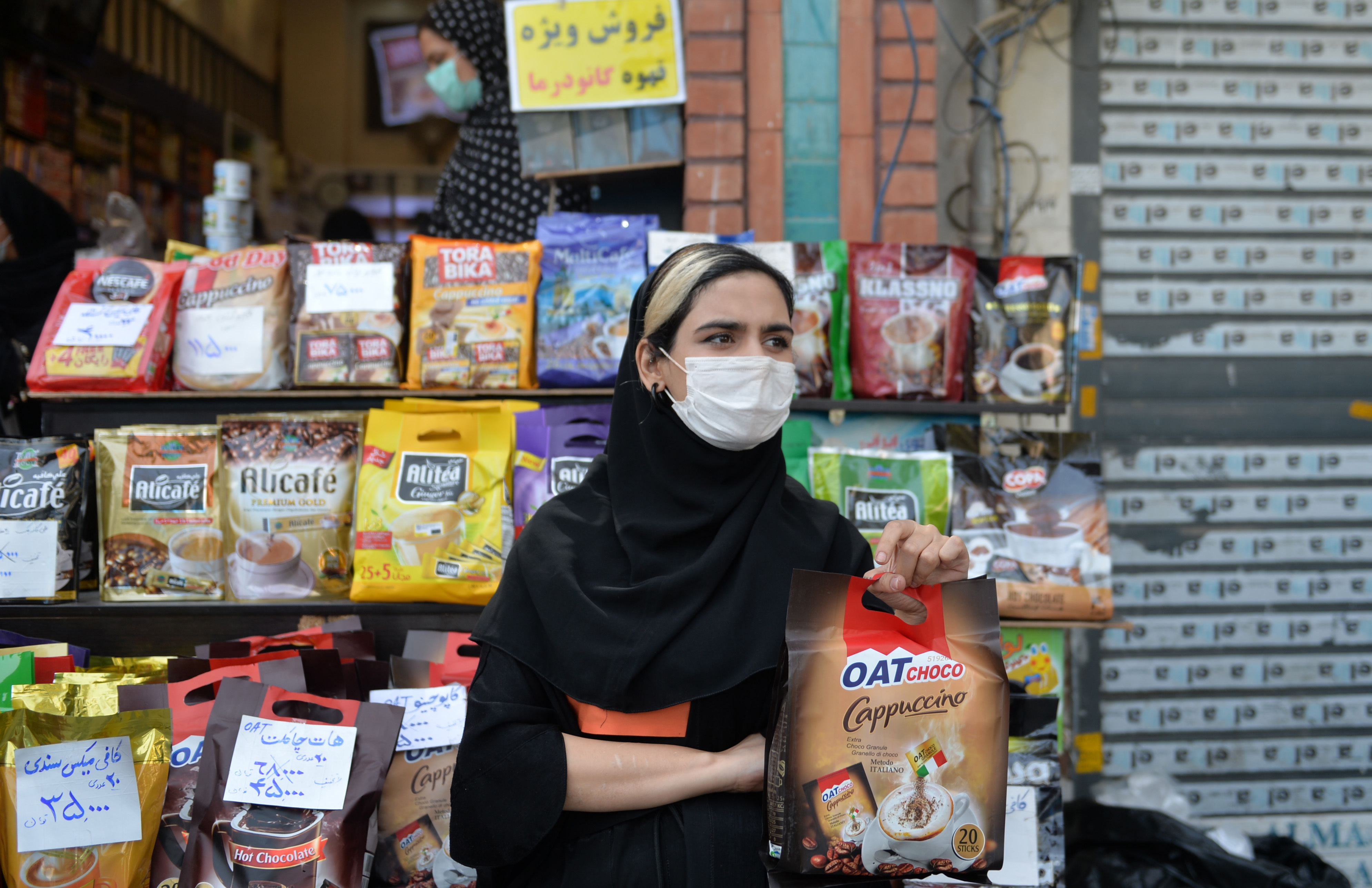 More women than men work in outdoor markets like this one in Tehran. Restrictions on public gatherings have forced many such shops and stands out of business. (Photo by Fatemeh Bahrami/Anadolu Agency via Getty Images)