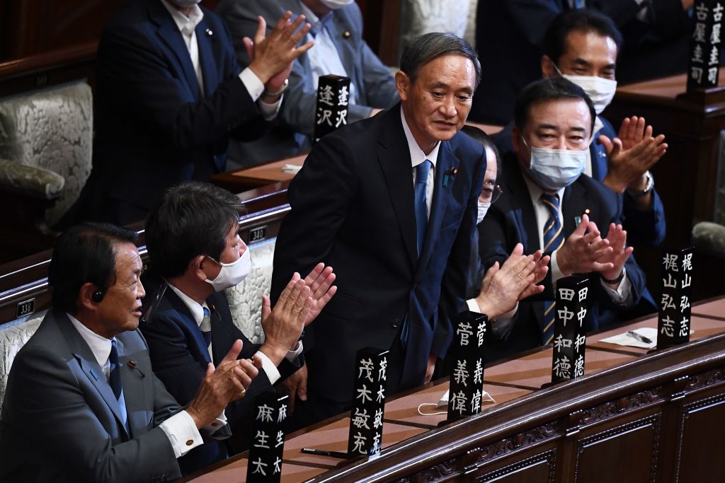 Newly elected leader of Japan's Liberal Democratic Party (LDP) Yoshihide Suga is applauded after he was elected as Japan's prime minister by the Lower House of parliament in Tokyo on Sept. 16, 2020. (Charly Triballeau–AFP/Getty Images)