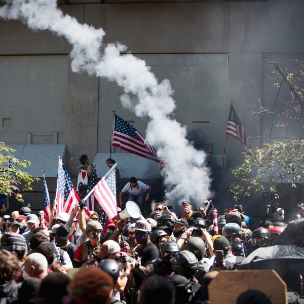 Far-right protesters clash with left-wing counter­protesters at the Justice Center in Portland, Ore., on Aug. 22