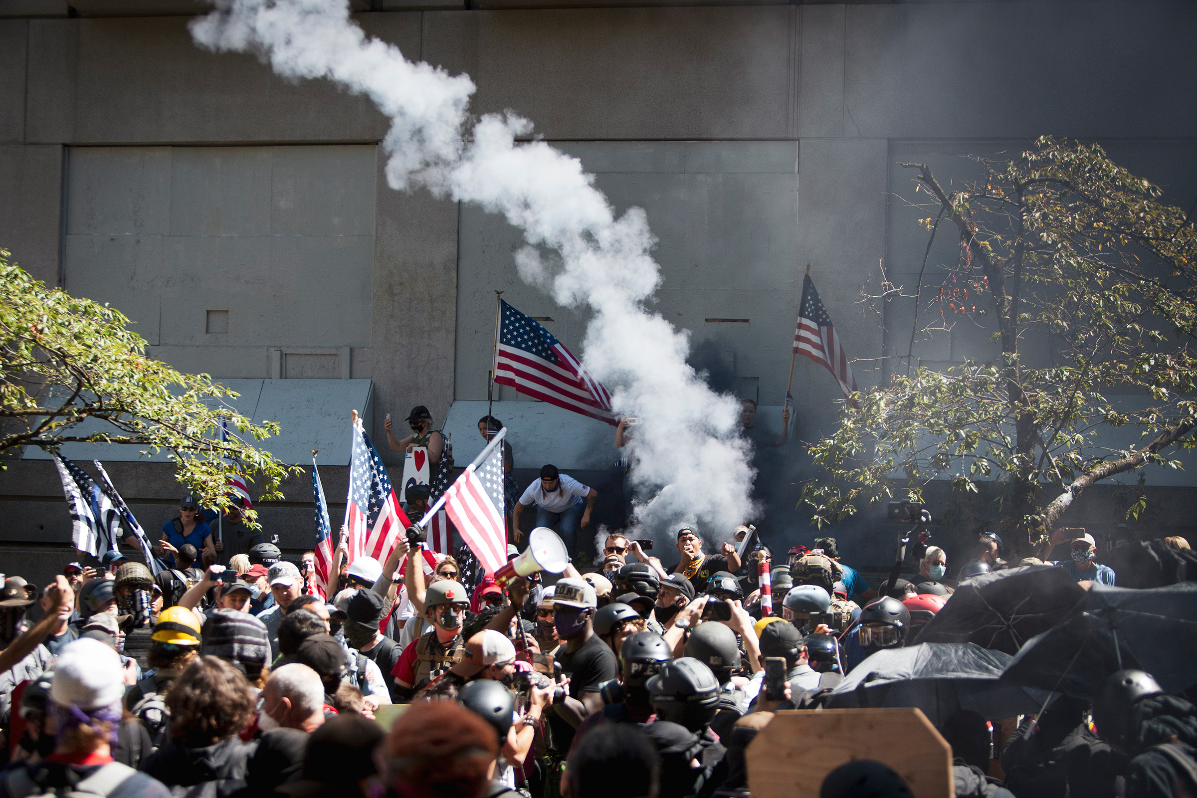 Far-right protesters clash with left-wing counter­protesters at the Justice Center in Portland, Ore., on Aug. 22 (Brooke Herbert—The Oregonian/AP)