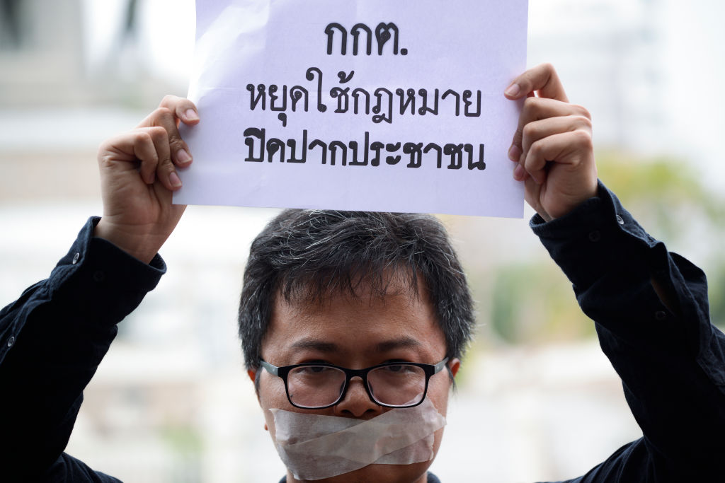 Human rights lawyer Arnon Nampa holds a poster during election protests in Bangkok, Thailand on April 7, 2019. (Anusak Laowilas—NurPhoto/Getty Images)