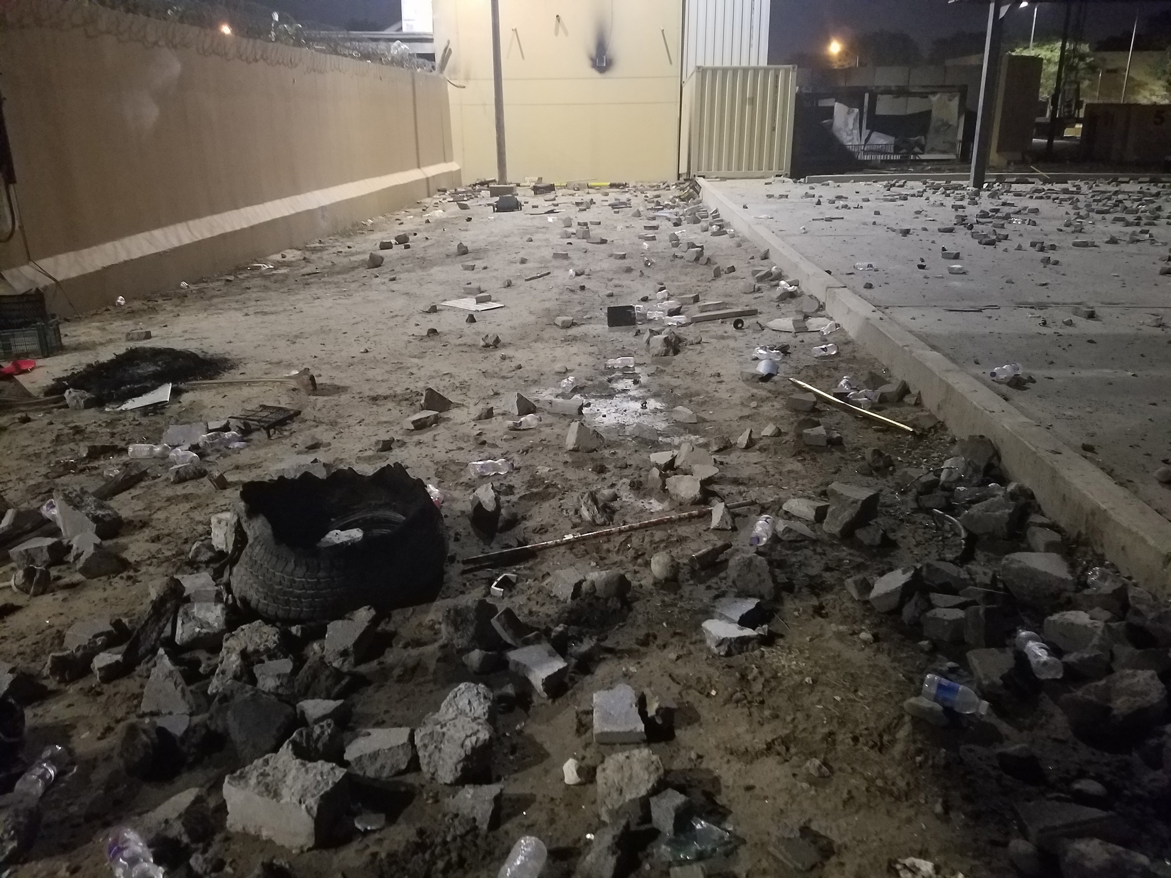 Debris and burned items in the aftermath of an attack on the U.S. embassy in Baghdad on Dec. 31, 2019.