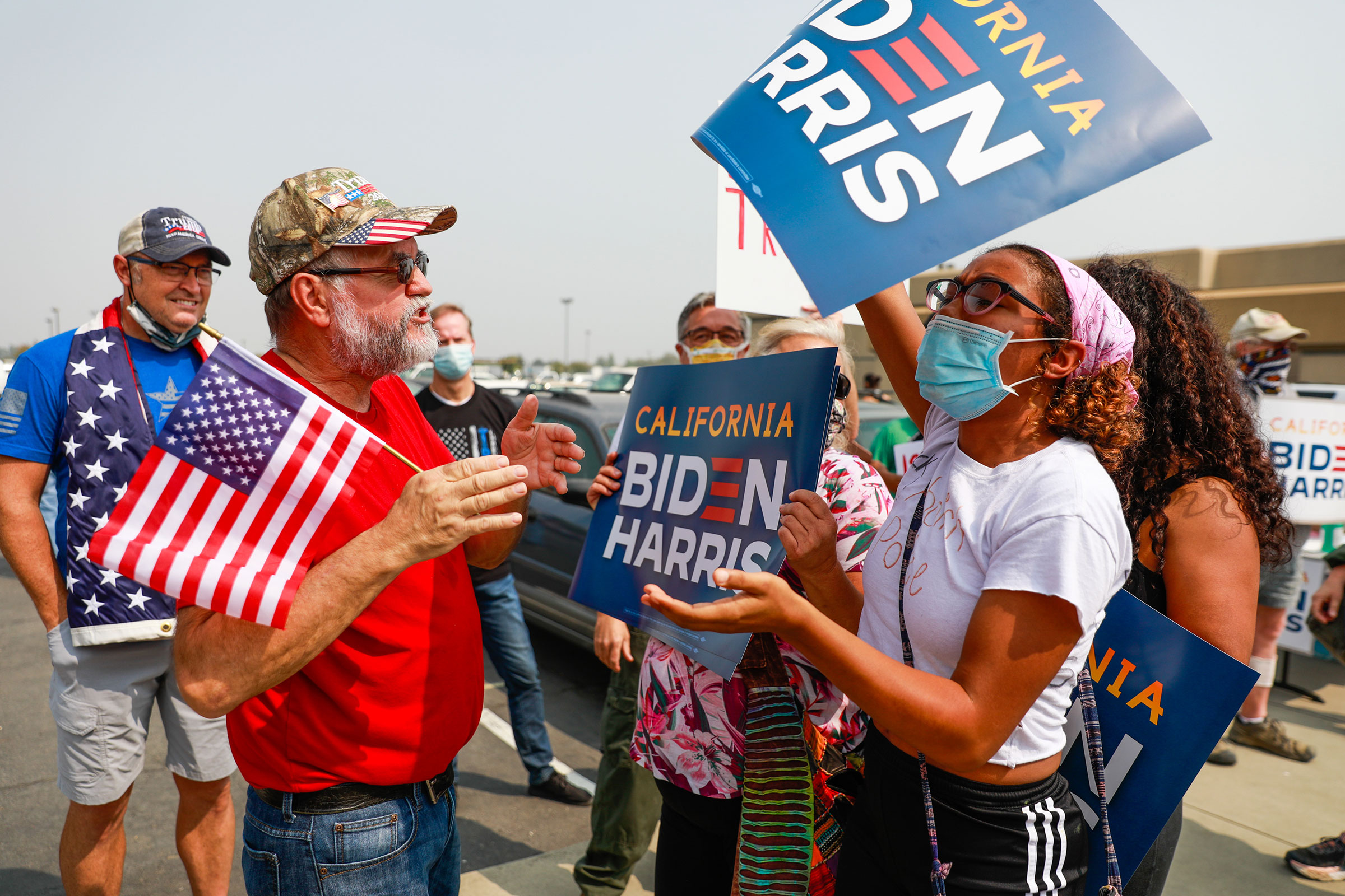 A Trump supporter argues with a Biden supporter on the street outside Sacramento McClellan Airport as President Donald Trump was being briefed on wildfires in a hangar in McClellan Park, Sacramento, Calif., on Sept. 14, 2020. (Gabrielle Lurie—The San Francisco Chronicle/Getty Images)