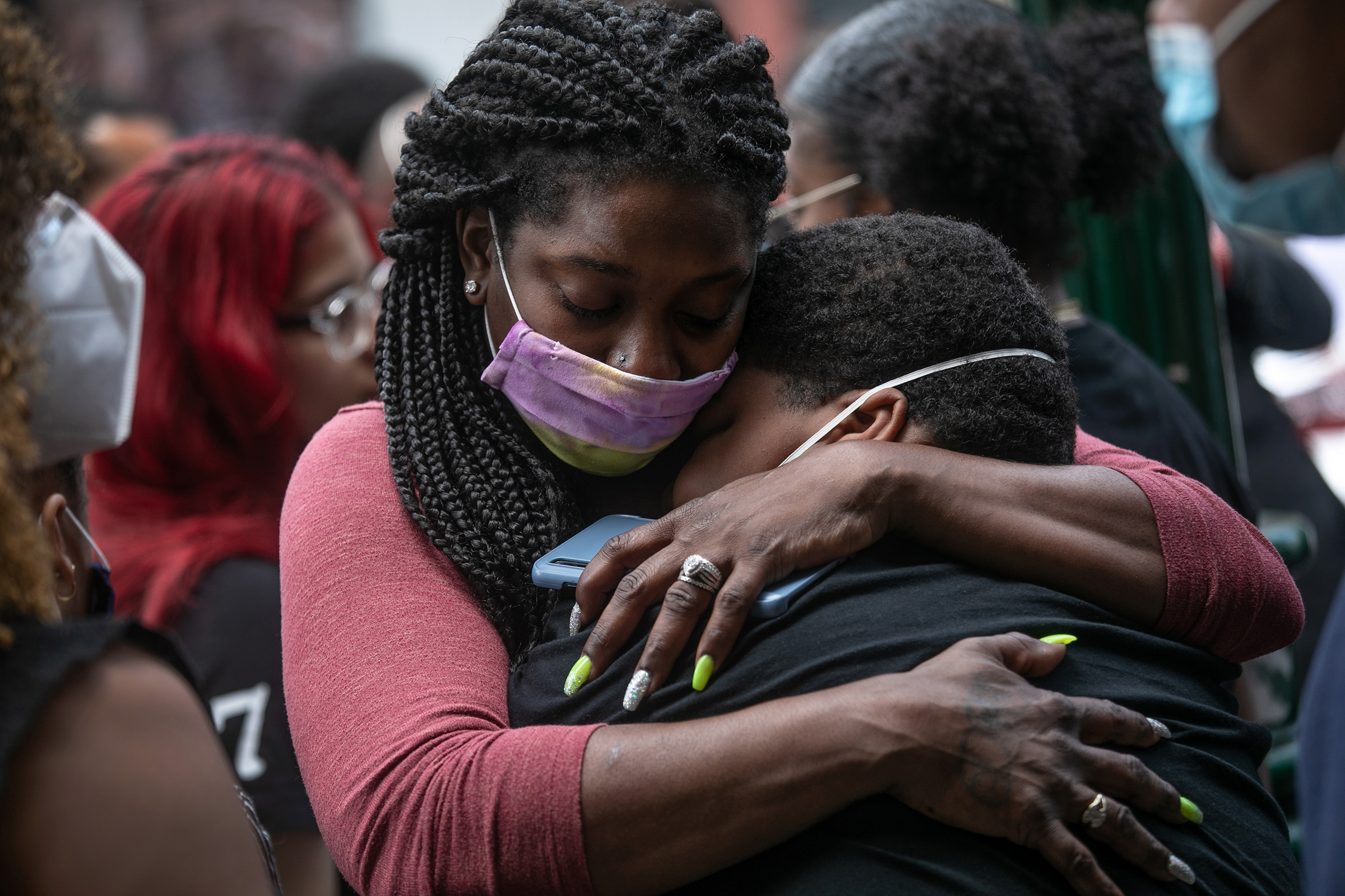 Friends and family mourn the death of Conrad Coleman Jr. on July 3 in New Rochelle, N.Y. Coleman, 39, died of COVID-19 on June 20, just over two months after his father also died of the disease (John Moore—Getty Images)