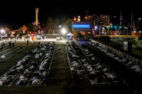 People sleeping in a parking lot in Las Vegas on March 30 after a homeless shelter shut down because of COVID-19