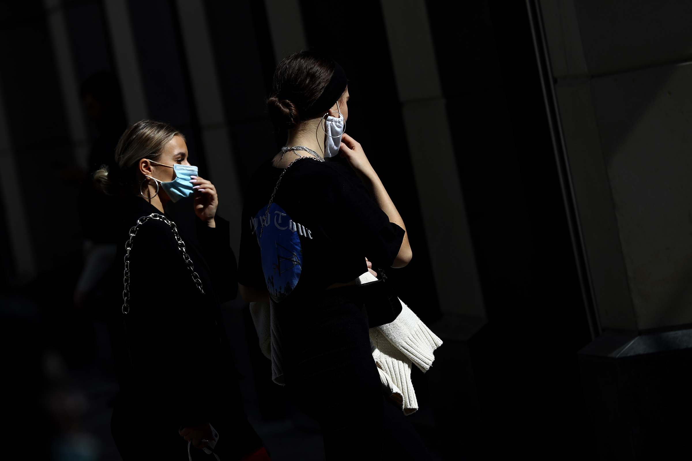 Young women wearing face masks as they walk trough downtown Munich, Germany on Sept. 22, 2020. (Matthias Schrader—AP)