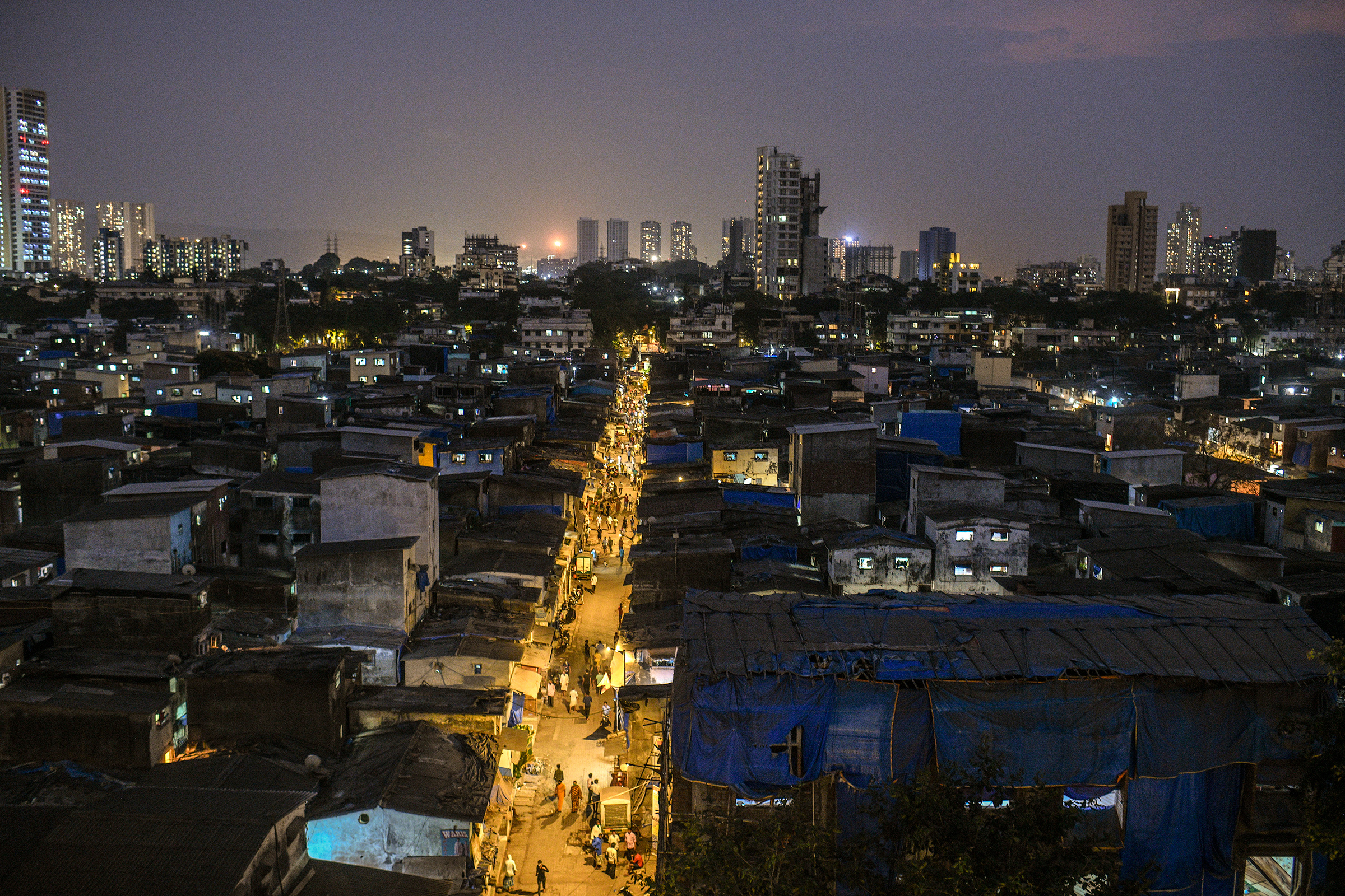 Dharavi in late April. The hyper-dense network of brick homes and small scale enterprises, which sprawl in the shadow of shiny new skyscrapers, was home to a thriving economy—until recently. (Atul Loke—The New York Times/Redux)