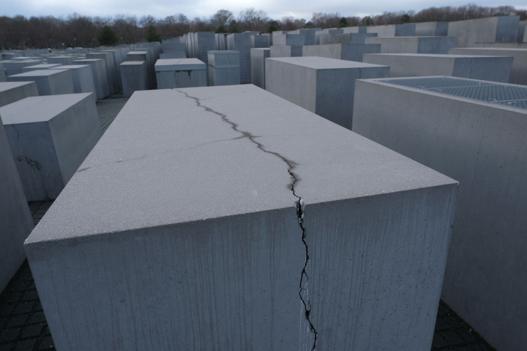 A crack cuts through one of the thousands of stellae at the Memorial to the Murdered Jews of Europe, also called the Holocaust Memorial, on Jan. 29, 2019 in Berlin. Many of the memorial's stellae show similar damage. (Sean Gallup—Getty Images)