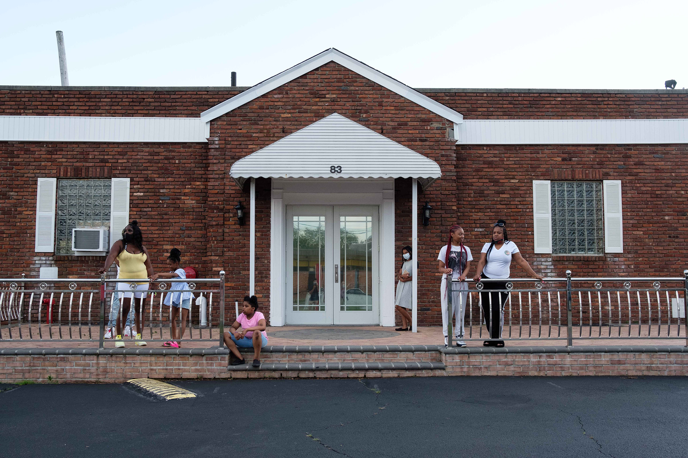 Family and friends gather outside Judea United Baptist Church during Jamel Floyd’s wake in Hempstead, N.Y. on June 29. (Yuki Iwamura)