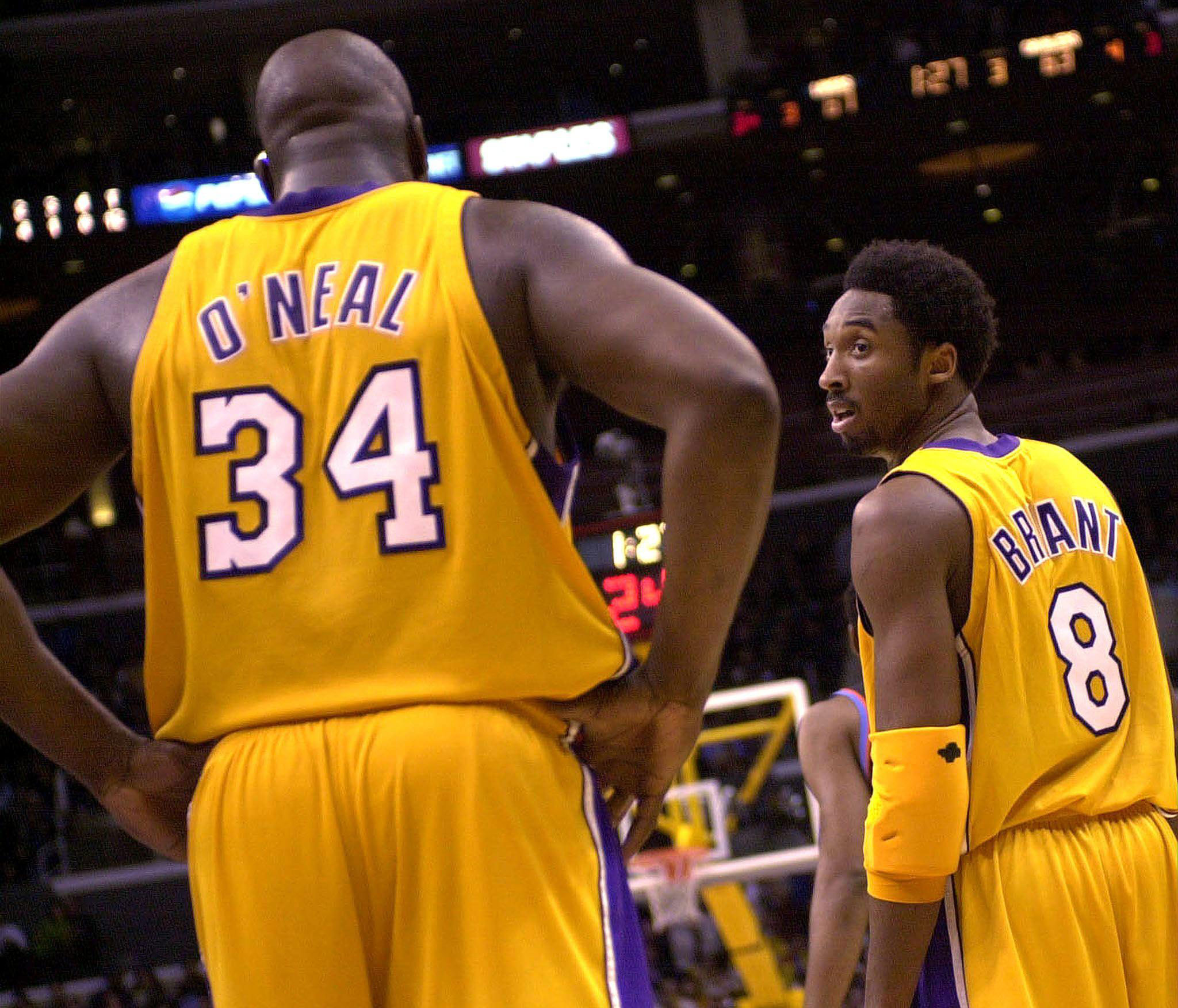 Kobe Bryant of the Los Angeles Lakers looks back toward teammate Shaquille O'Neal during their game against the Cleveland Cavaliers