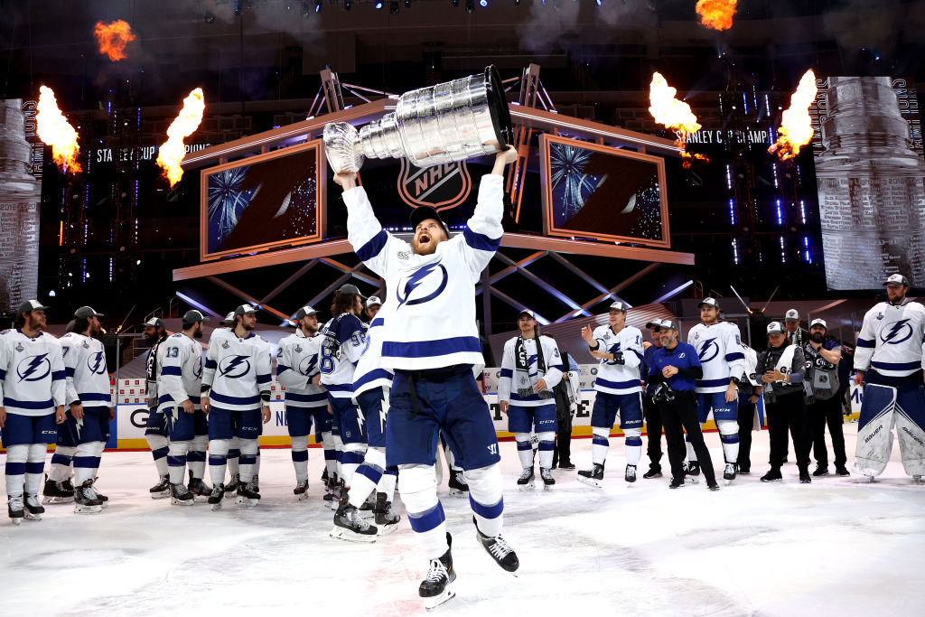 Blake Coleman #20 of the Tampa Bay Lightning hoists the Stanley Cup overhead