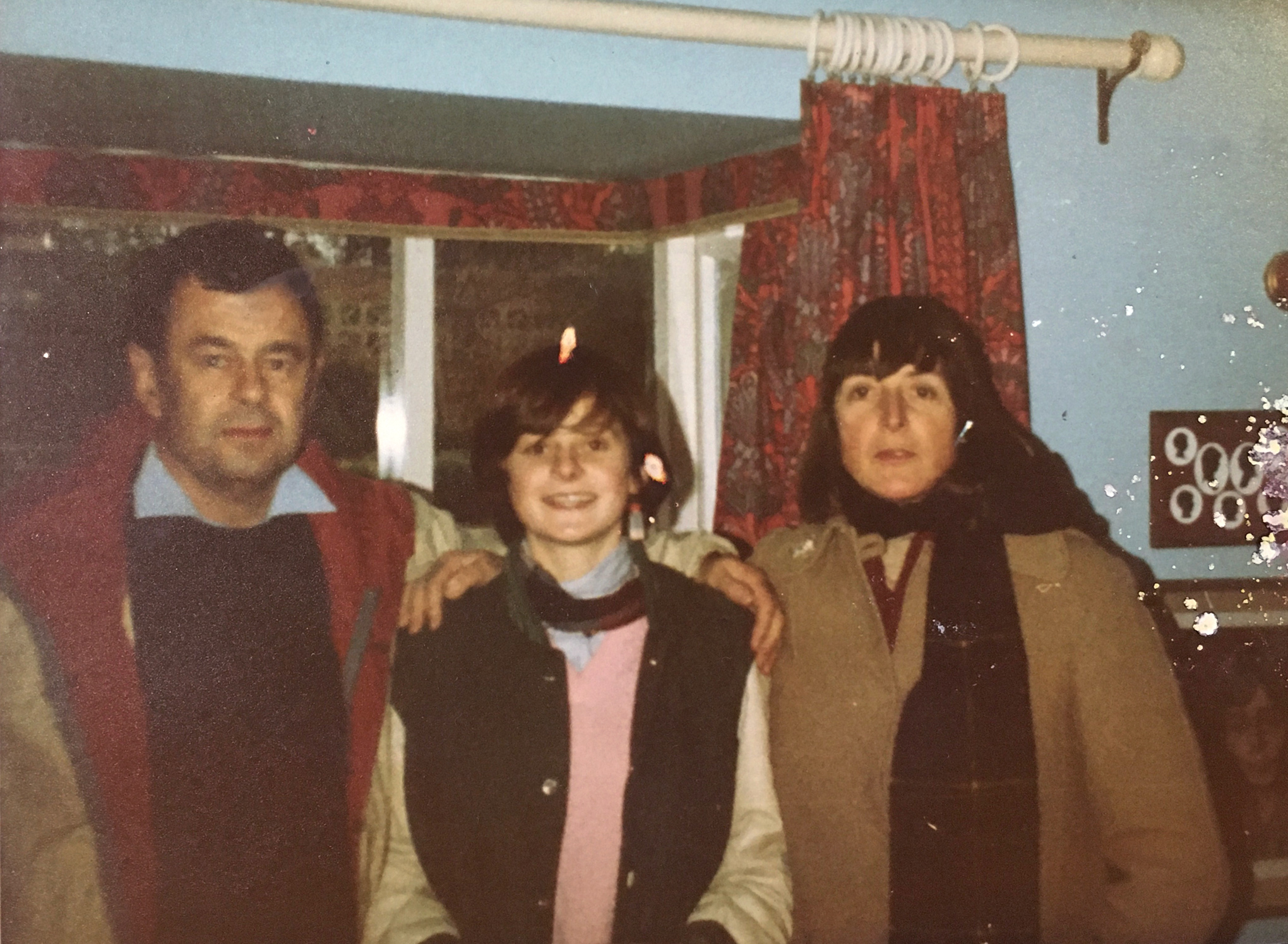 with her parents, circa 1983. (Courtesy Belinda Luscombe The author)