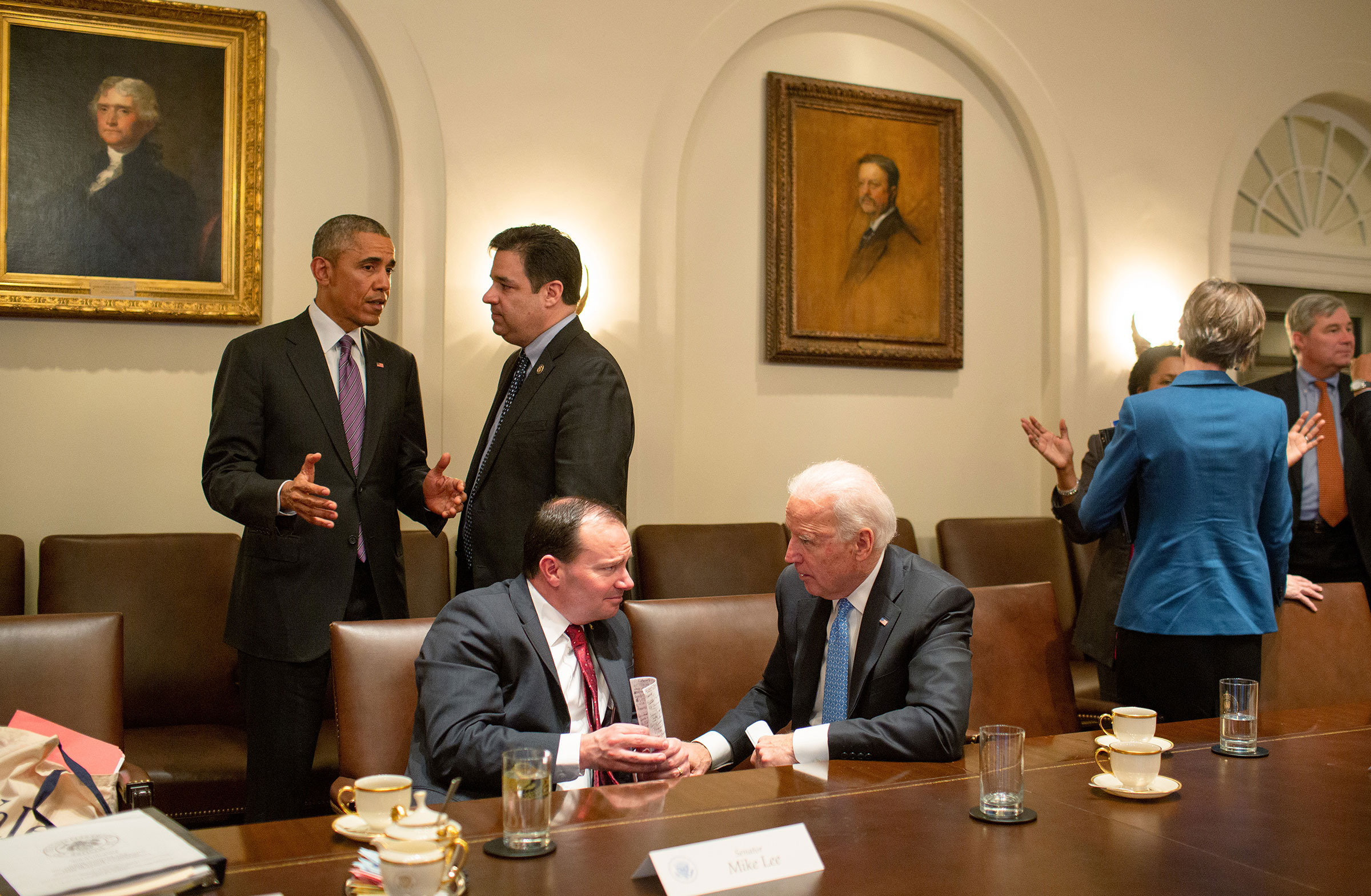 President Barack Obama talks with Rep. Rual Labrador as Vice President Joe Biden talks with Sen. Mike Lee following a meeting with bipartisan Members of Congress to discuss criminal justice reform, in the Cabinet Room of the White House, on Feb. 24, 2015.