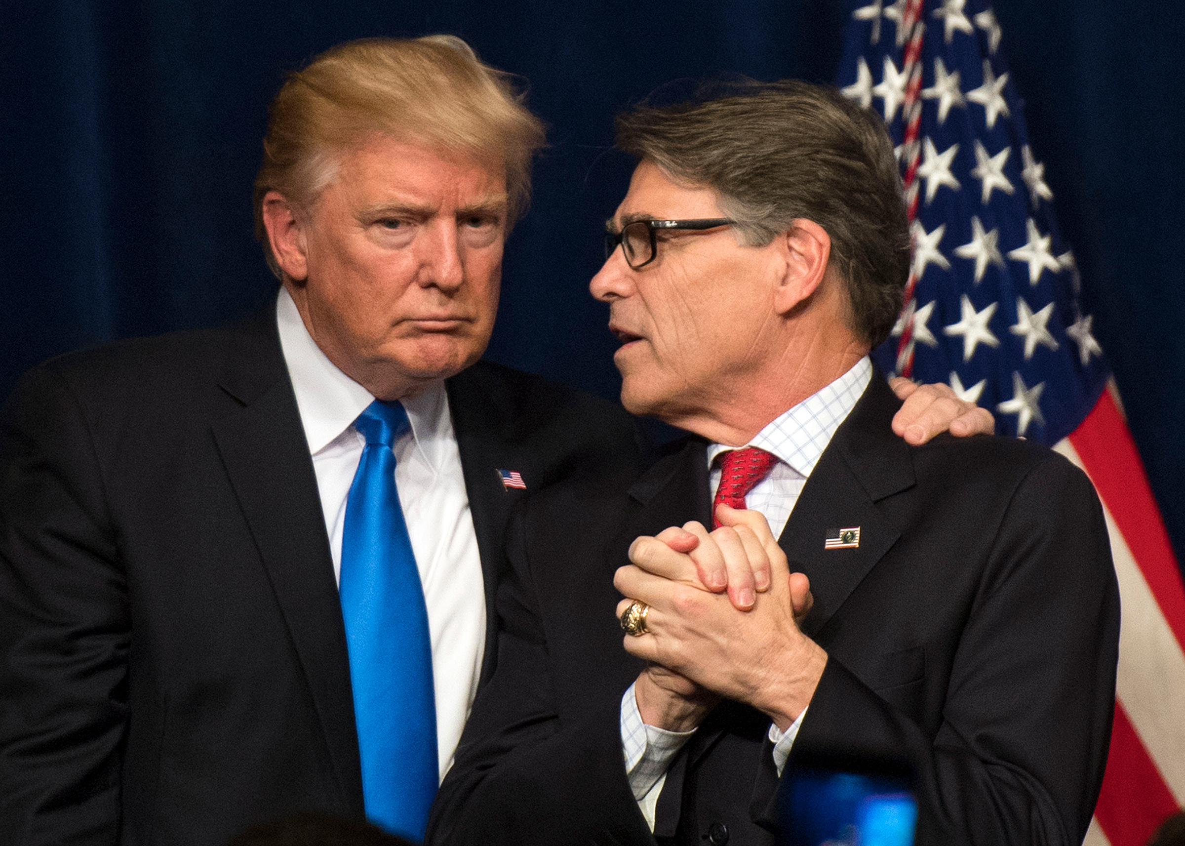 Trump and Perry embrace after a June 2017 event in Washington (Kevin Dietsch—UPI/Reuters)