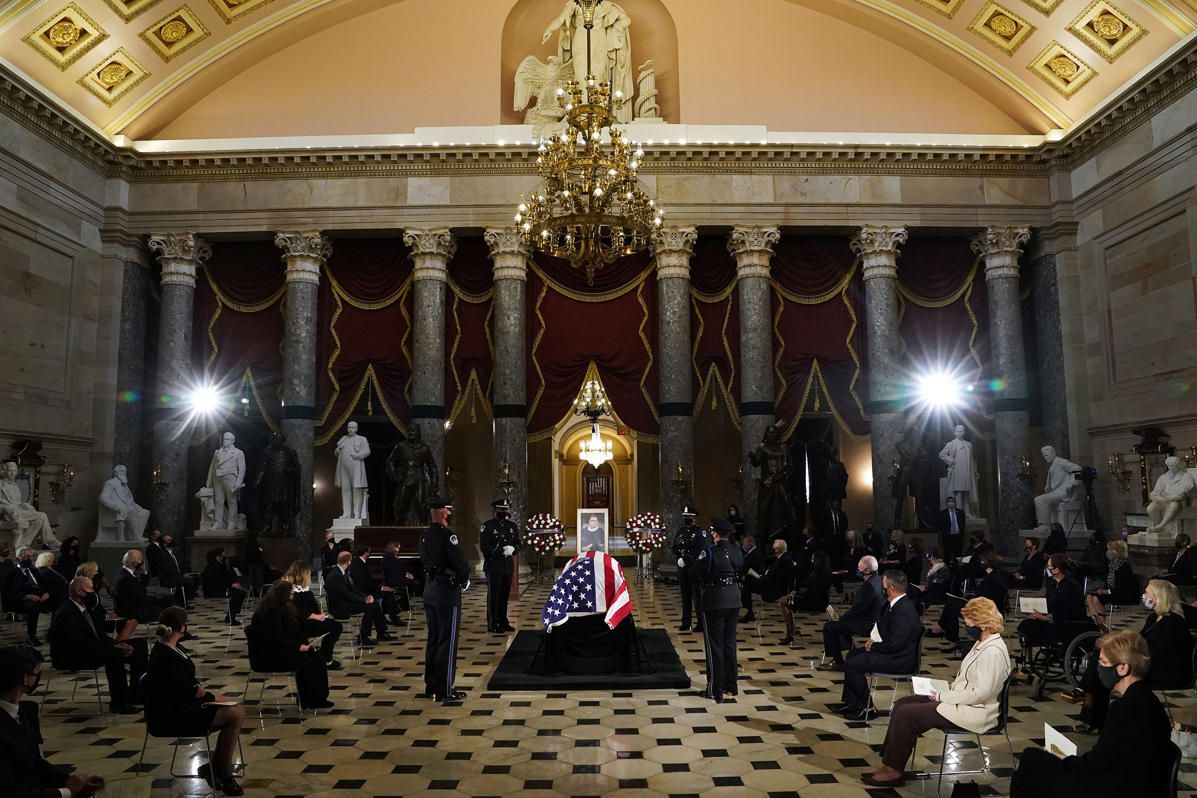 The flag-draped casket of the late Associate Justice Ruth Bader Ginsburg lies in state in Statuary Hall of the US Capitol during a memorial service in her honor on Sept. 25, 2020. (Erin Schaff—Pool/Getty Images)