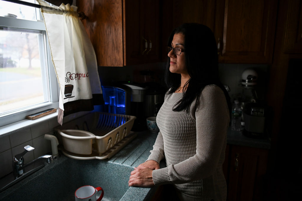 Sandra Diaz, who worked at the Trump National Golf Club Bedminster before getting her Green Card, poses for a portrait at home in Bound Brook, NJ on January 7, 2019. (Photo by Carolyn Van Houten/The Washington Post via Getty Images)