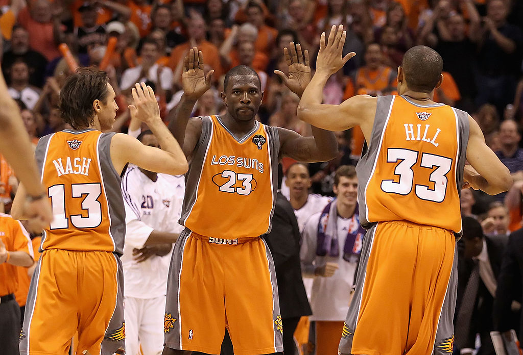 Jason Richardson #23 of the Phoenix Suns high-fives teammates Steve Nash #13 and Grant Hill #33 after scoring against the San Antonio Spurs on May 5, 2010 in Phoenix, Ariz. (Christian Petersen—Getty Images)