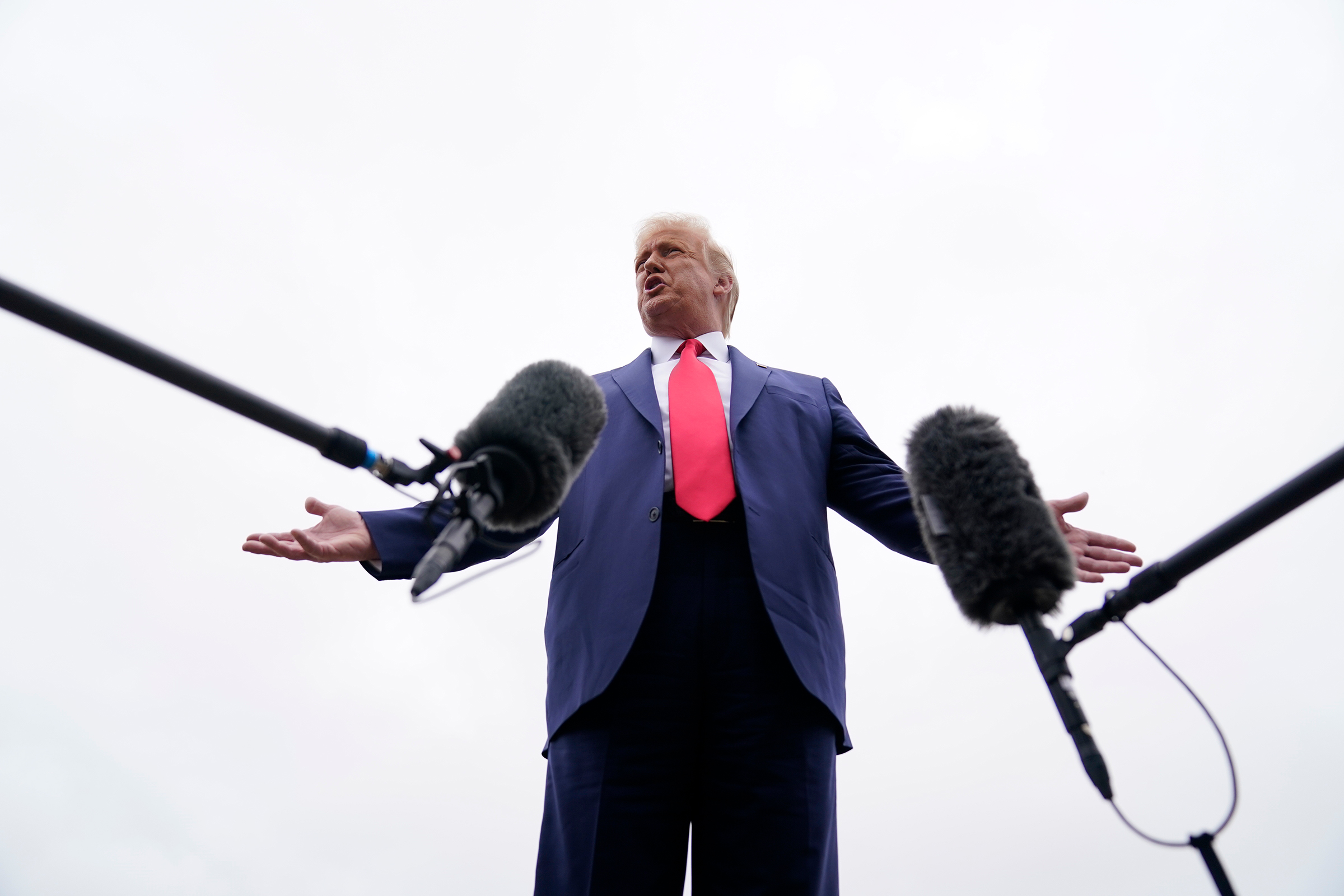 President Donald Trump speaks to the media in Andrews Air Force Base, Md., before boarding Air Force One for a trip to Kenosha, Wis., Sept. 1, 2020.