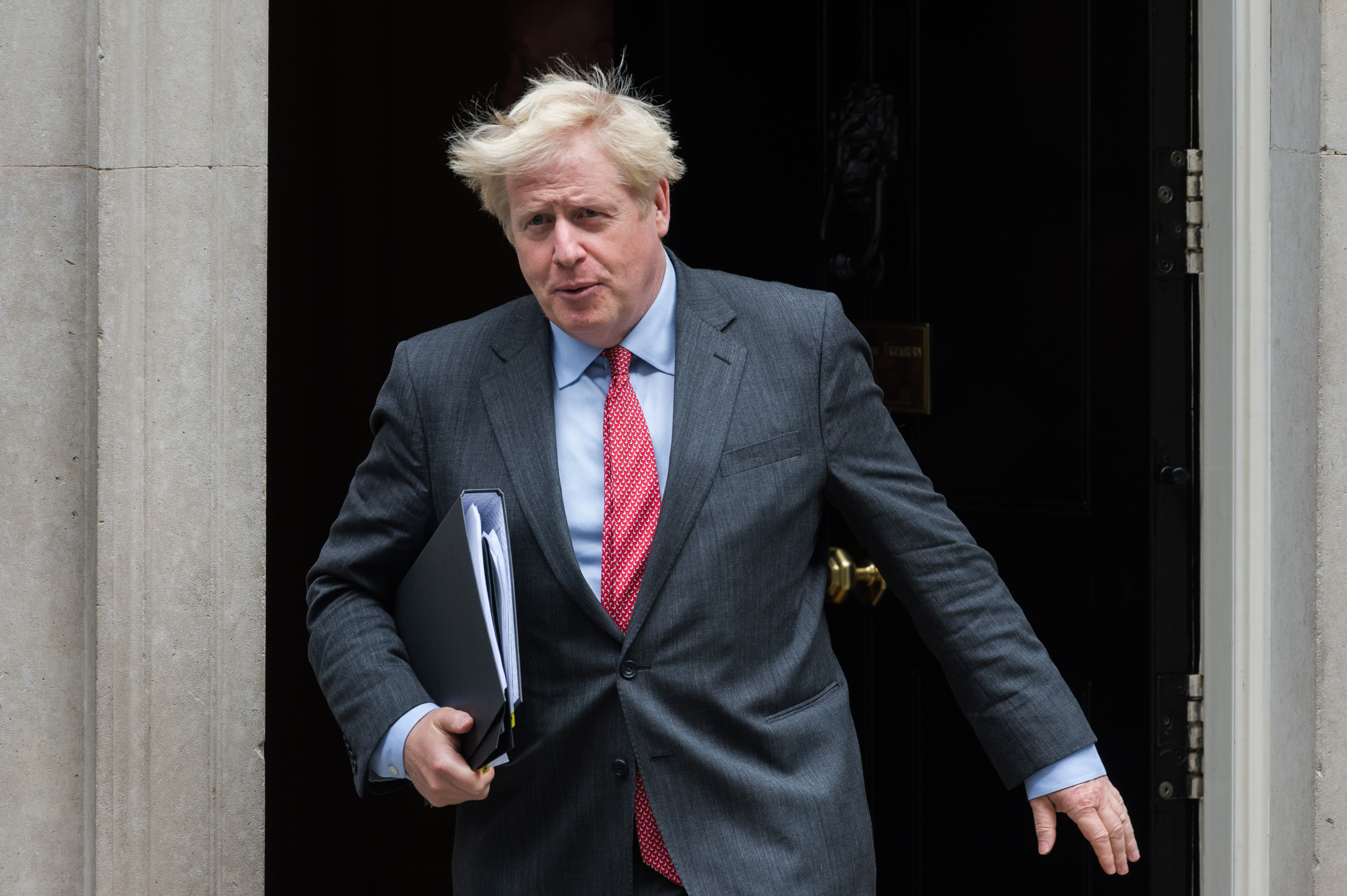 British Prime Minister Boris Johnson leaves 10 Downing Street for the House of Commons to deliver a statement on tightening coronavirus restrictions amid widespread increase in daily infection rates across the U.K., on 22 September, 2020 (NurPhoto via Getty Images&mdash;WIktor Szymanowicz/NurPhoto)