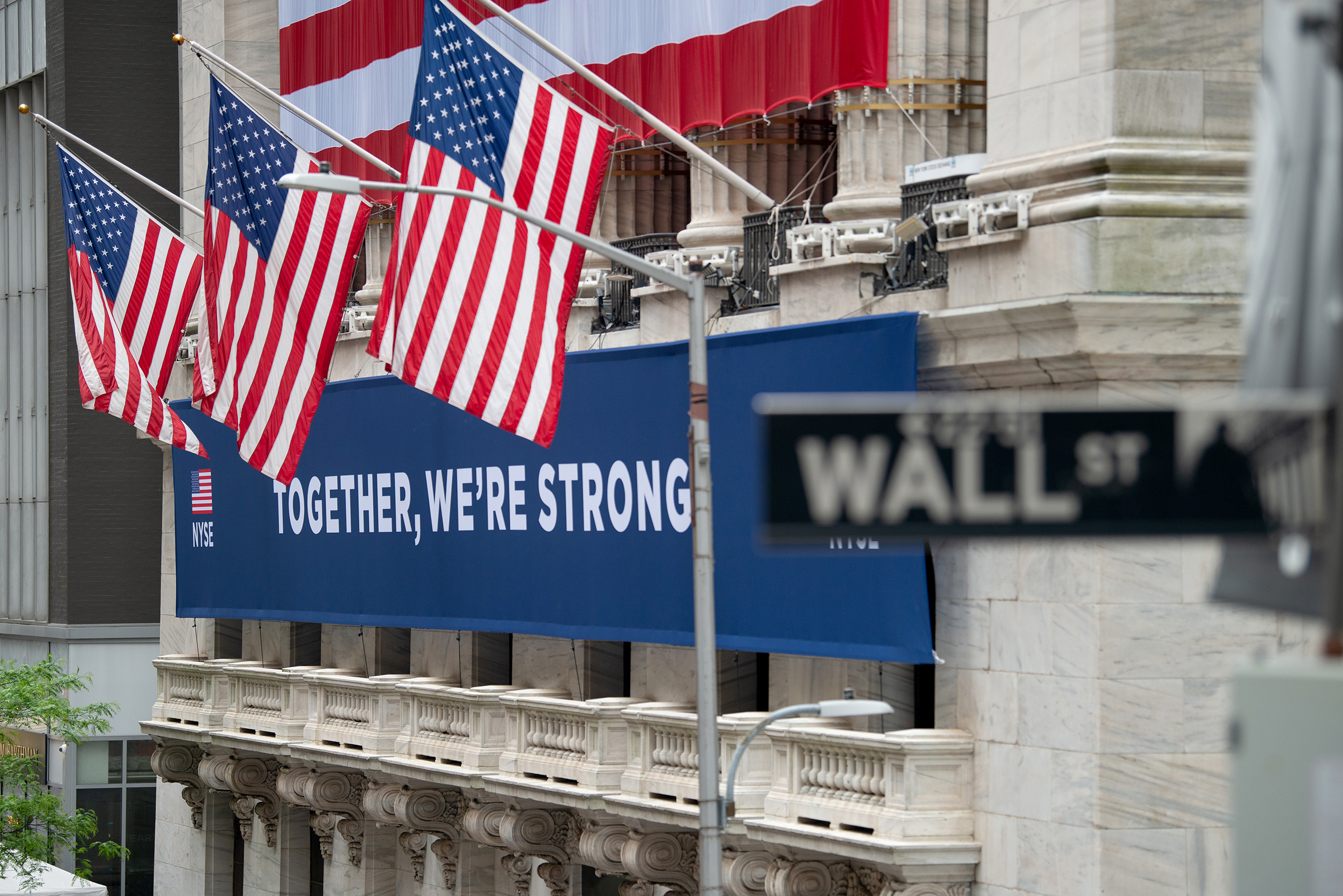 A view of the "Together, We're Strong" banner in front of the New York Stock Exchange on May 28 (Alexi Rosenfeld—Getty Images)