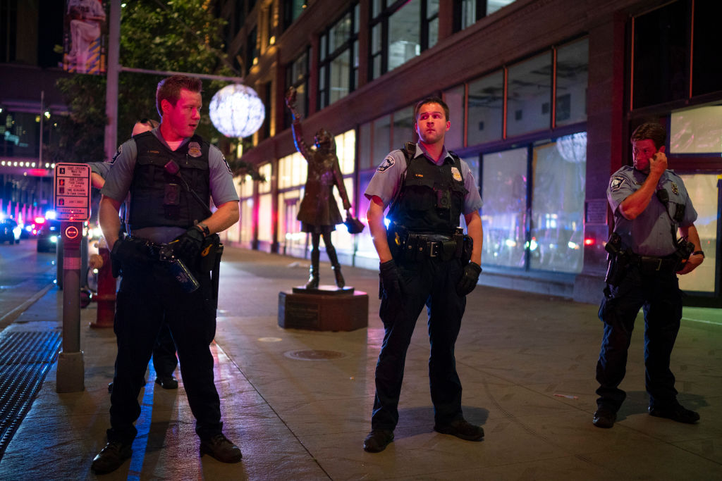 MINNEAPOLIS, MN - AUGUST 26: Minneapolis Police formed a line on the Nicollet Mall near where a Foot Locker store was looted on Aug. 26, 2020. (Jeff Wheeler—Star Tribune/Getty Images)