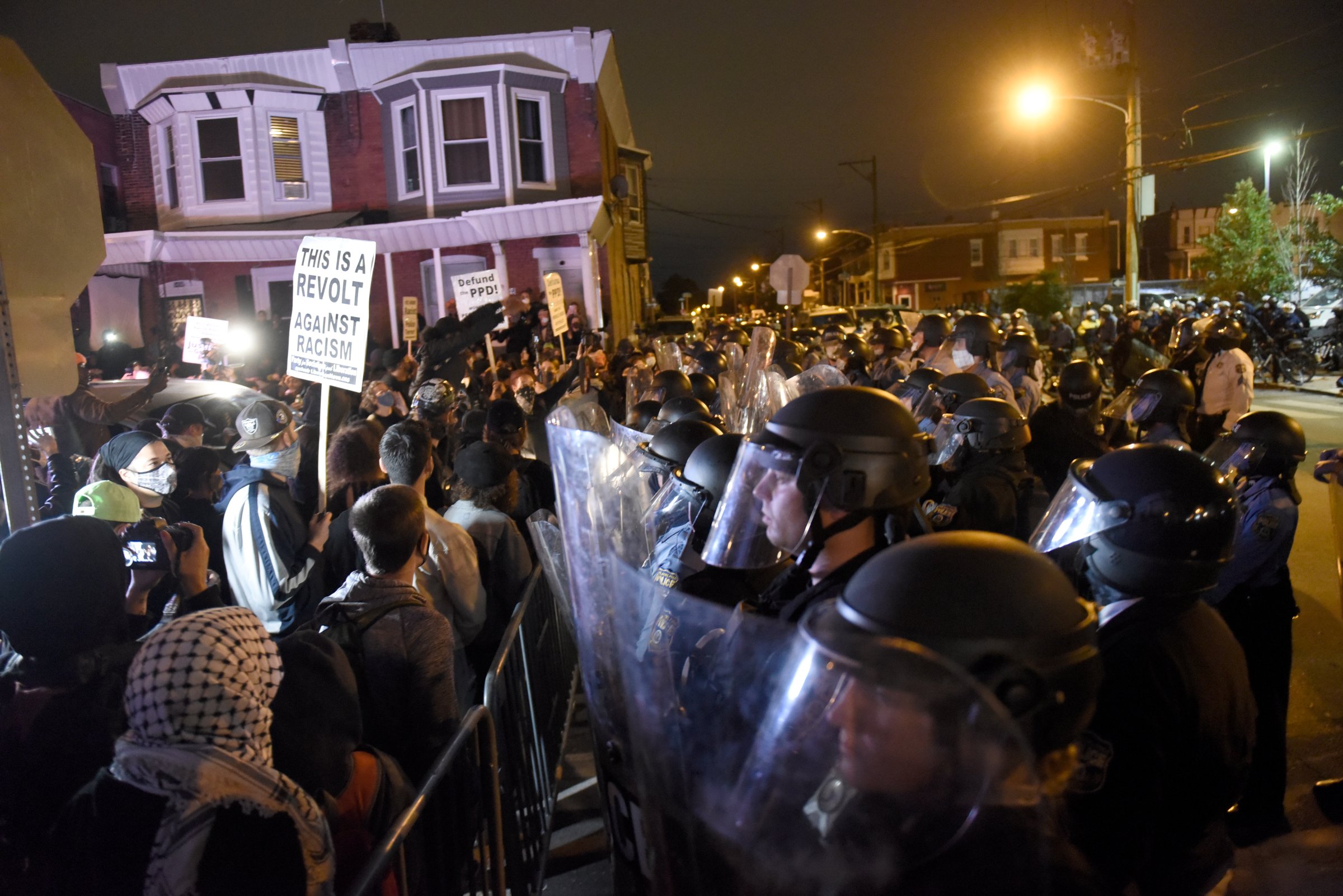 Protesters face off with police during a demonstration Tuesday, Oct. 27, 2020, in Philadelphia