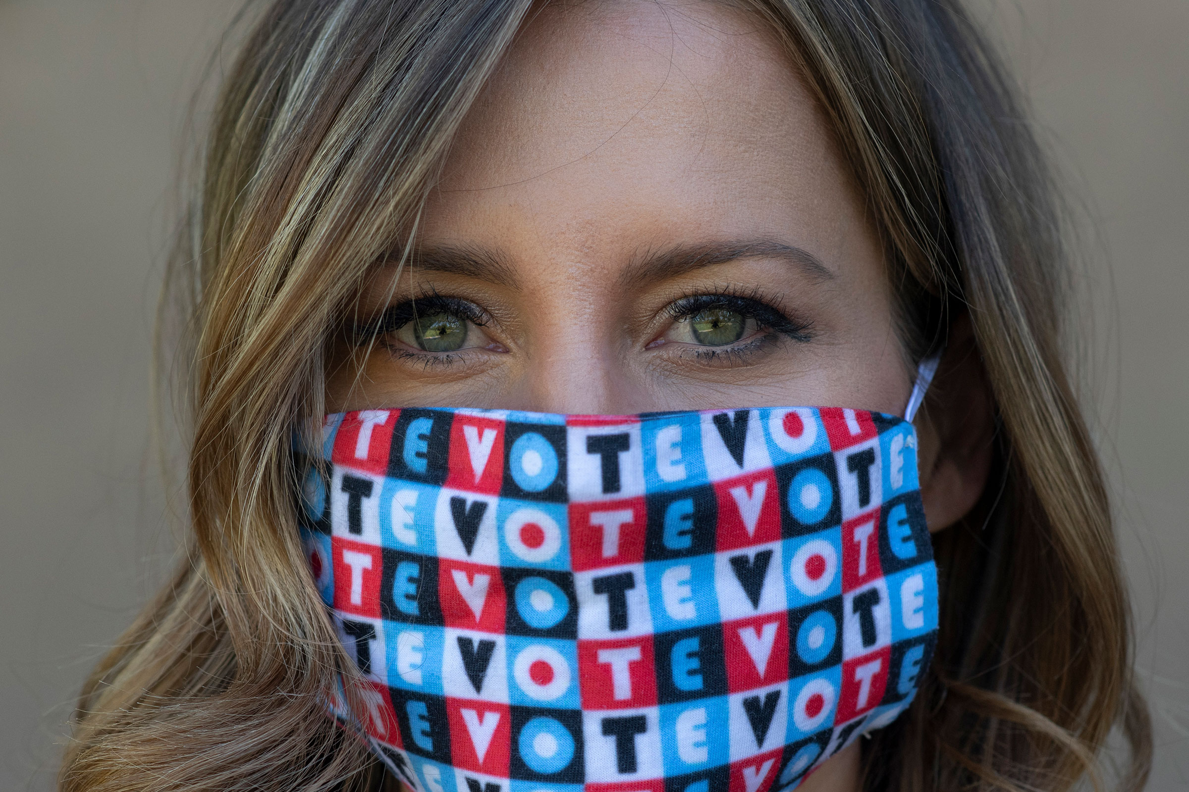 Amber McReynolds wearing a mask that says "vote" on Sept. 29, 2020.