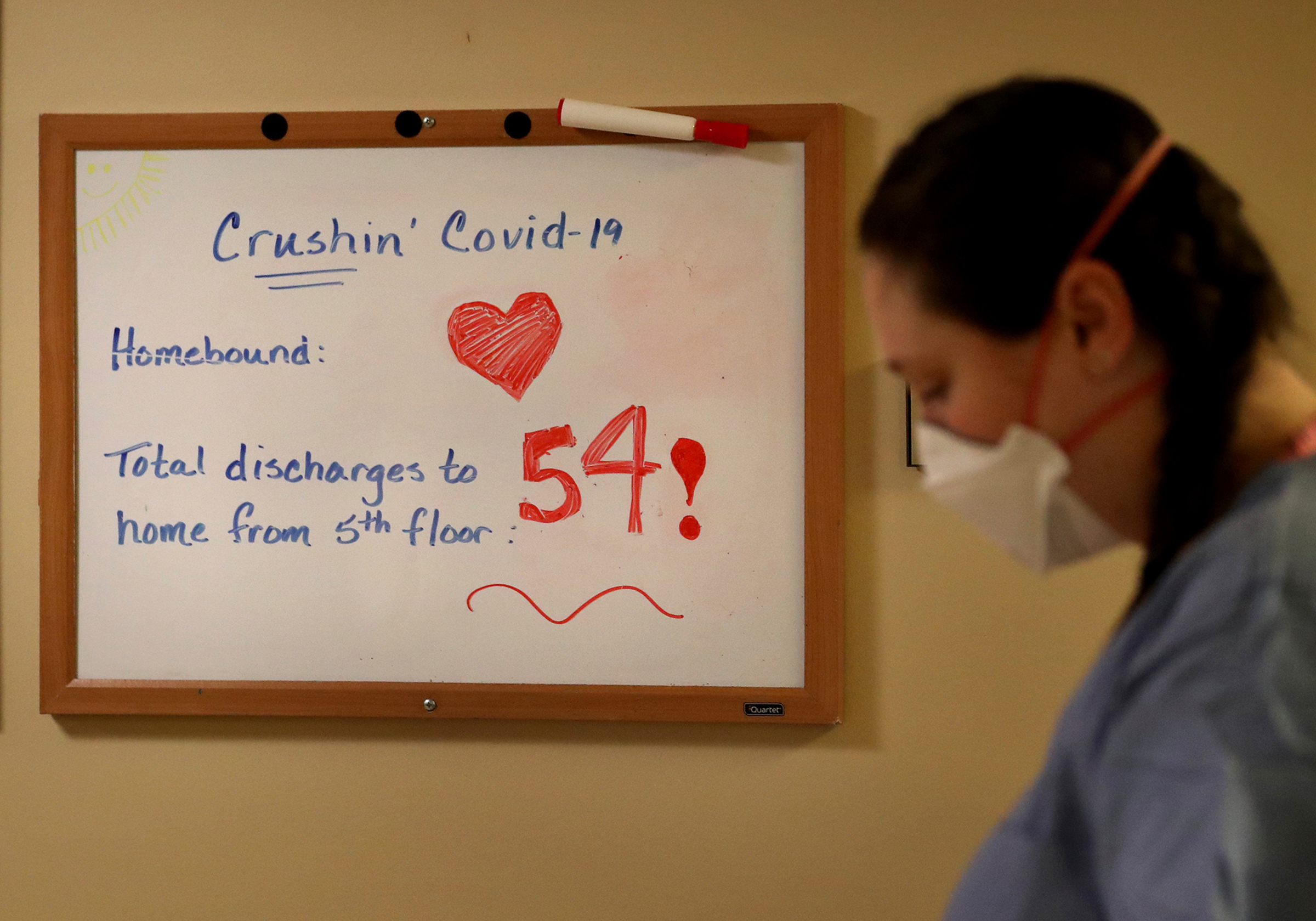 The number of COVID-19 patients recovered and discharged is tracked on a whiteboard on the fifth floor of Bethesda Hospital on May 7 in St. Paul