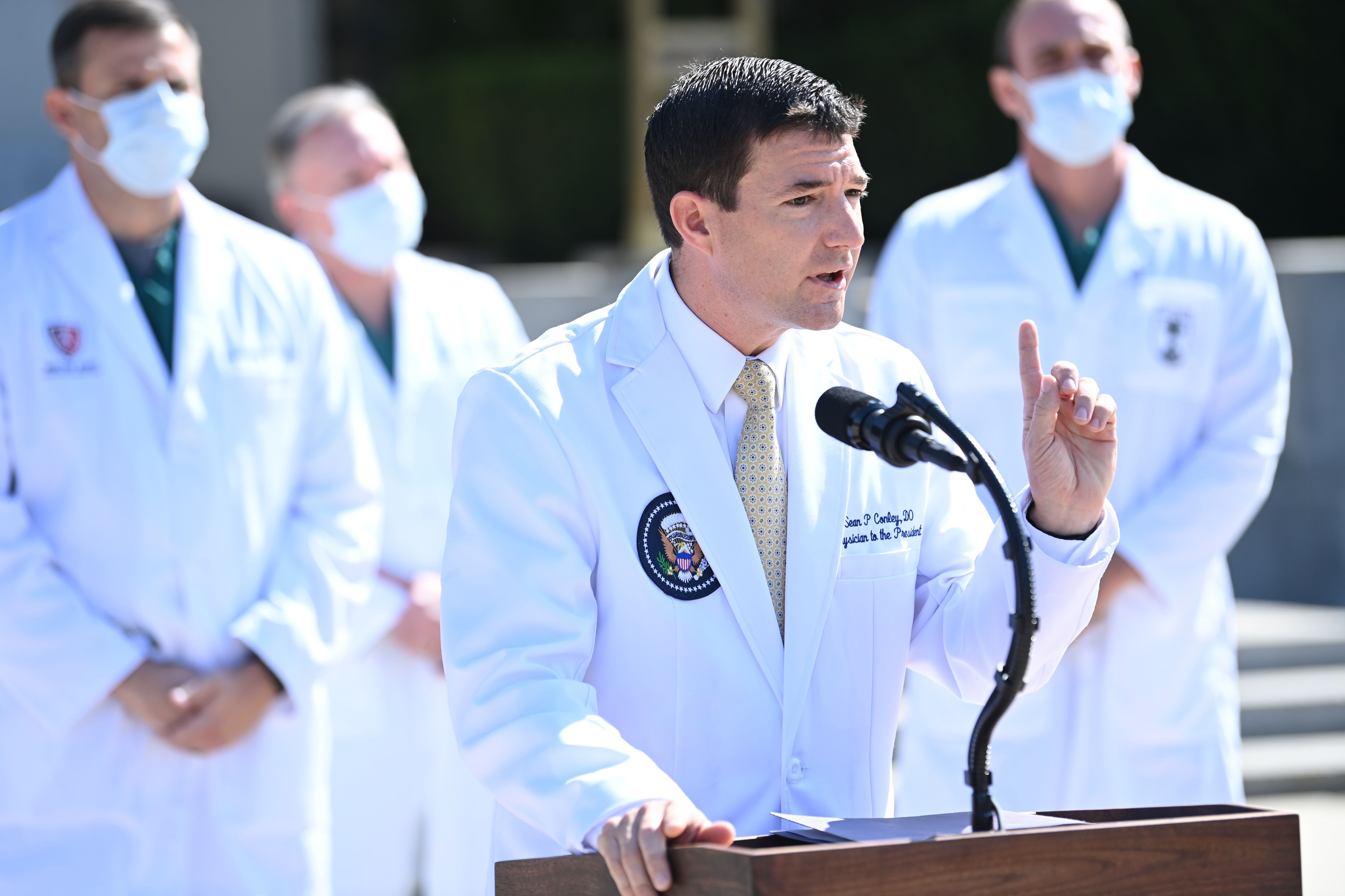 White House physician Sean Conley answers questions surrounded by other doctors, during an update on the condition of US President Donald Trump, on October 4, at Walter Reed Medical Center in Bethesda, Maryland. (BRENDAN SMIALOWSKI / Contributor)