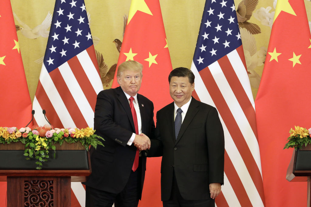 U.S. President Donald Trump, left, and Xi Jinping, China's president, shake hands during a news conference at the Great Hall of the People in Beijing, China, on Thursday, Nov. 9, 2017. (Qilai Shen/Bloomberg via Getty Images)