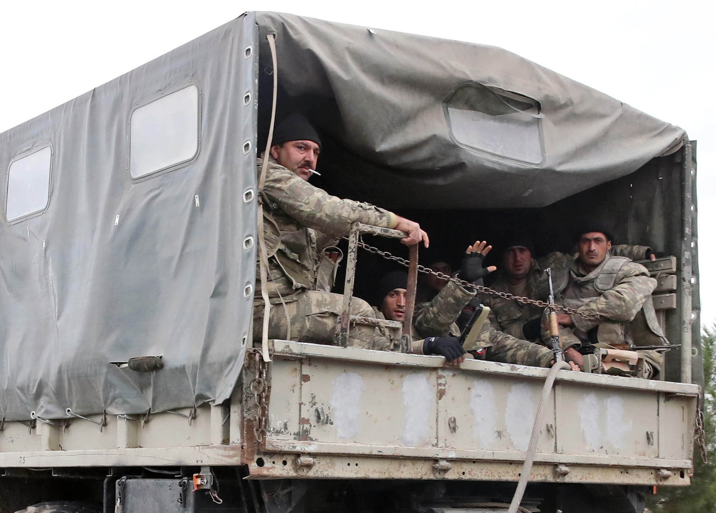 BARDA, AZERBAIJAN - OCTOBER 5, 2020: Azerbaijani servicemen are pictured in a personnel carrier. (Valery Sharifulin—TASS/Getty Images)