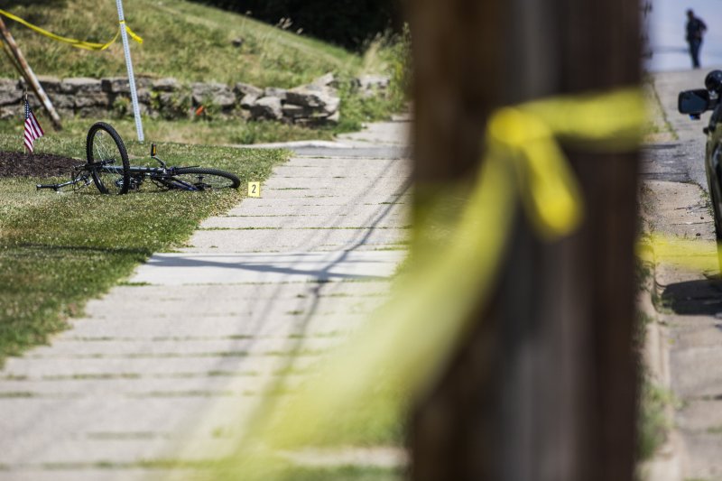 A bike is marked as evidence at the scene of a shooting on June 30, 2016 in Grand Rapids, Mich. In one of the worst periods of violence in 2020 for the city, 11 people were shot across the weekend of Sept. 12 and 13. Grand Rapids police responded by placing over 100 officers on the streets the following weekend, during which they collected 10 illegal weapons and made 16 felony arrests.