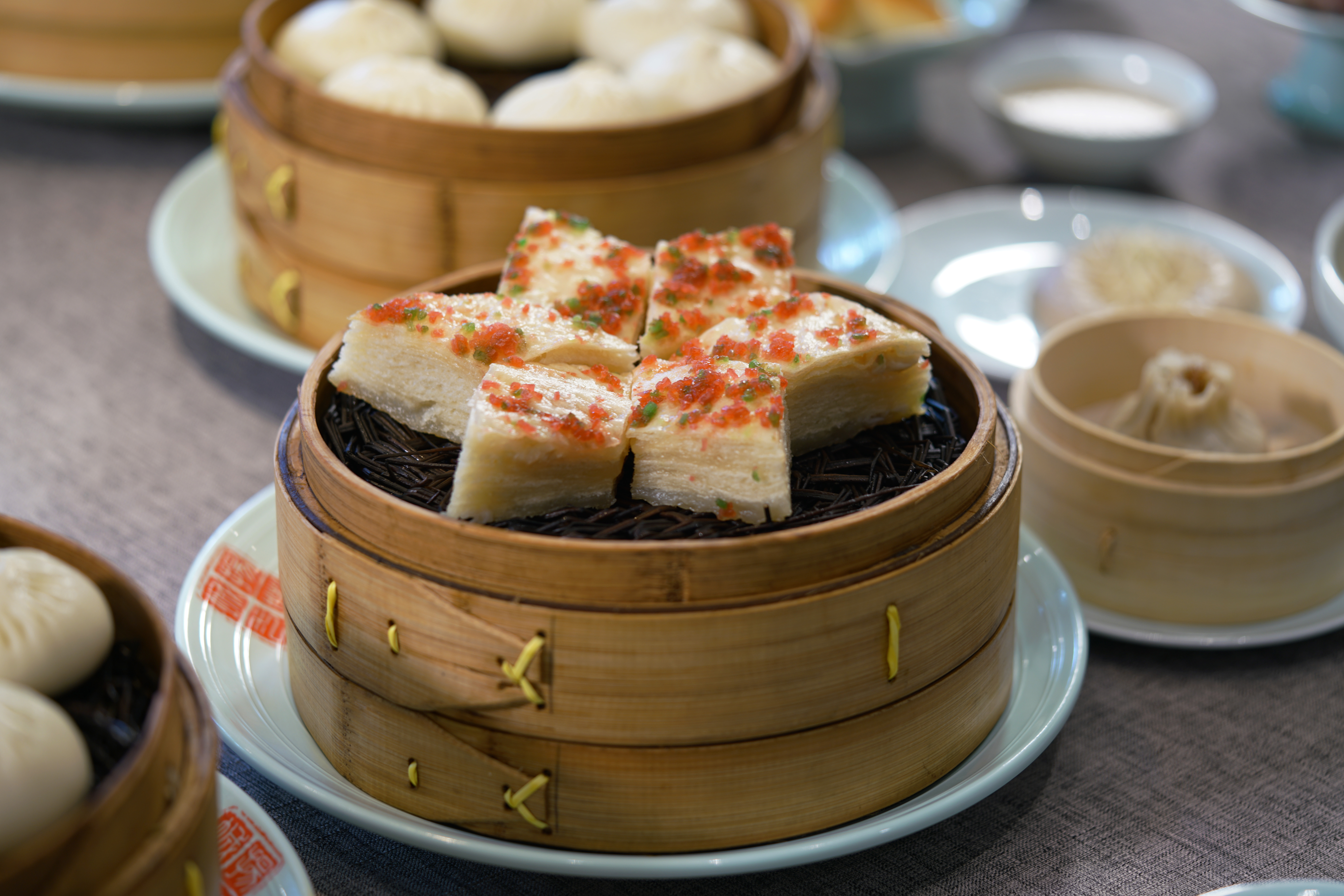 In this still taken from Season 2 of the series Once Upon a Bite, which debuted on Apr. 26, 2020, a dish known as multiple-layer oil cake is seen on a table in Yangzhou, China.