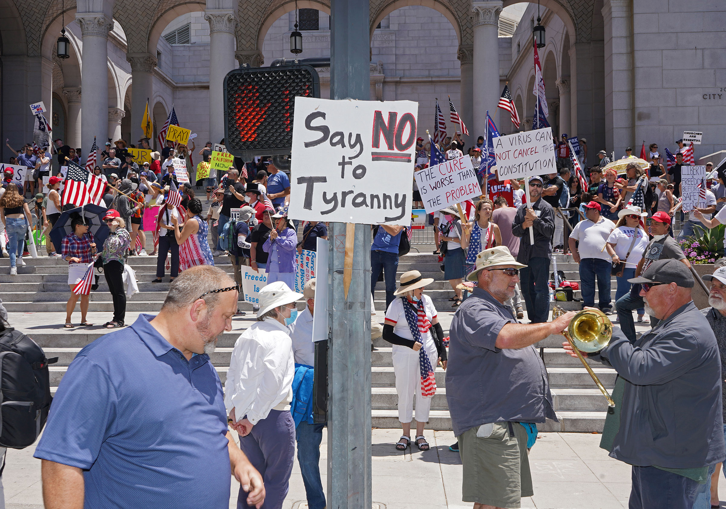 Protesters calling for a reopening of California from coronavirus lockdown measures and restrictions in front of City Hall in Los Angeles, May 24, 2020. (Jamie Lee Curtis Taete)
