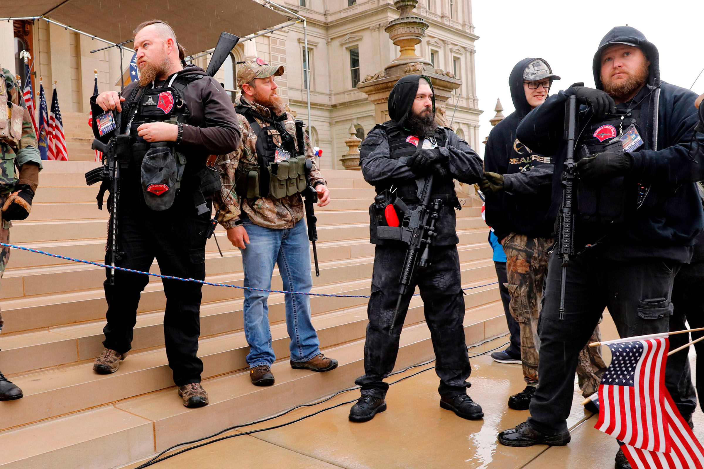 Michael Null (R) and William Null (L) arrive at the American Patriot Rally, to demand the reopening of businesses on the steps of the Michigan State Capitol in Lansing, Mich., on April 30, 2020. Thirteen men, including members of two right-wing militias, have been arrested for plotting to kidnap Michigan Gov. Gretchen Whitmer and "instigate a civil war", Michigan Attorney General Dana Nessel announced on October 8, 2020. The Nulls were charged for their alleged roles in the plot, according to the FBI. The brothers are charged with providing support for terroristic acts and felony weapons charges. (AFP via Getty Images&mdash;AFP or licensors)