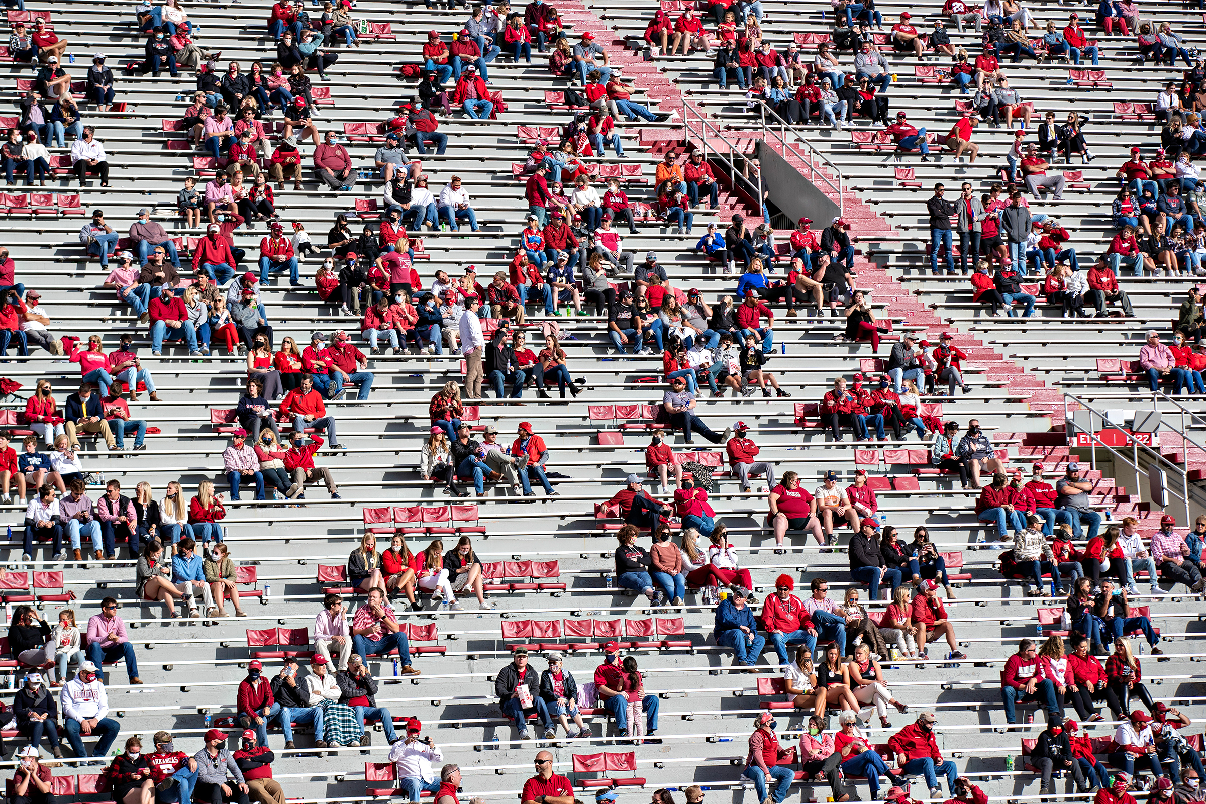 Socially distanced groups of fans during a game between the Arkansas Razorbacks and the Mississippi Rebels in Fayetteville, Ark., on Oct. 17, 2020.