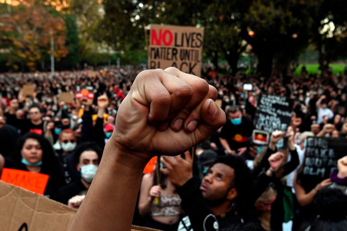 Demonstrators attend a Black Lives Matter protest to express solidarity with US protestors and demand an end to Aboriginal deaths in custody in Sydney, Australia, on June 6, 2020.